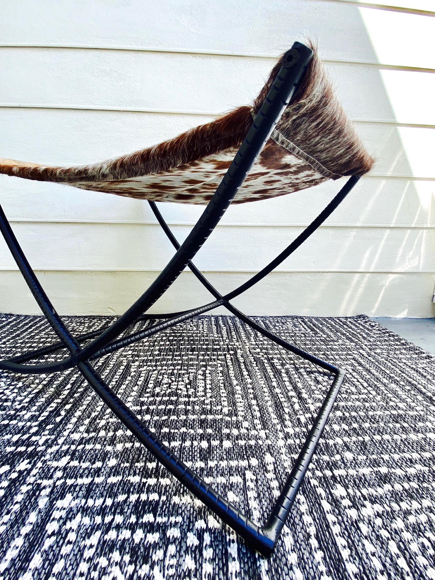 Cowhide Campaign Style Bench with Brown and White Leather Hide Seat and Iron Base