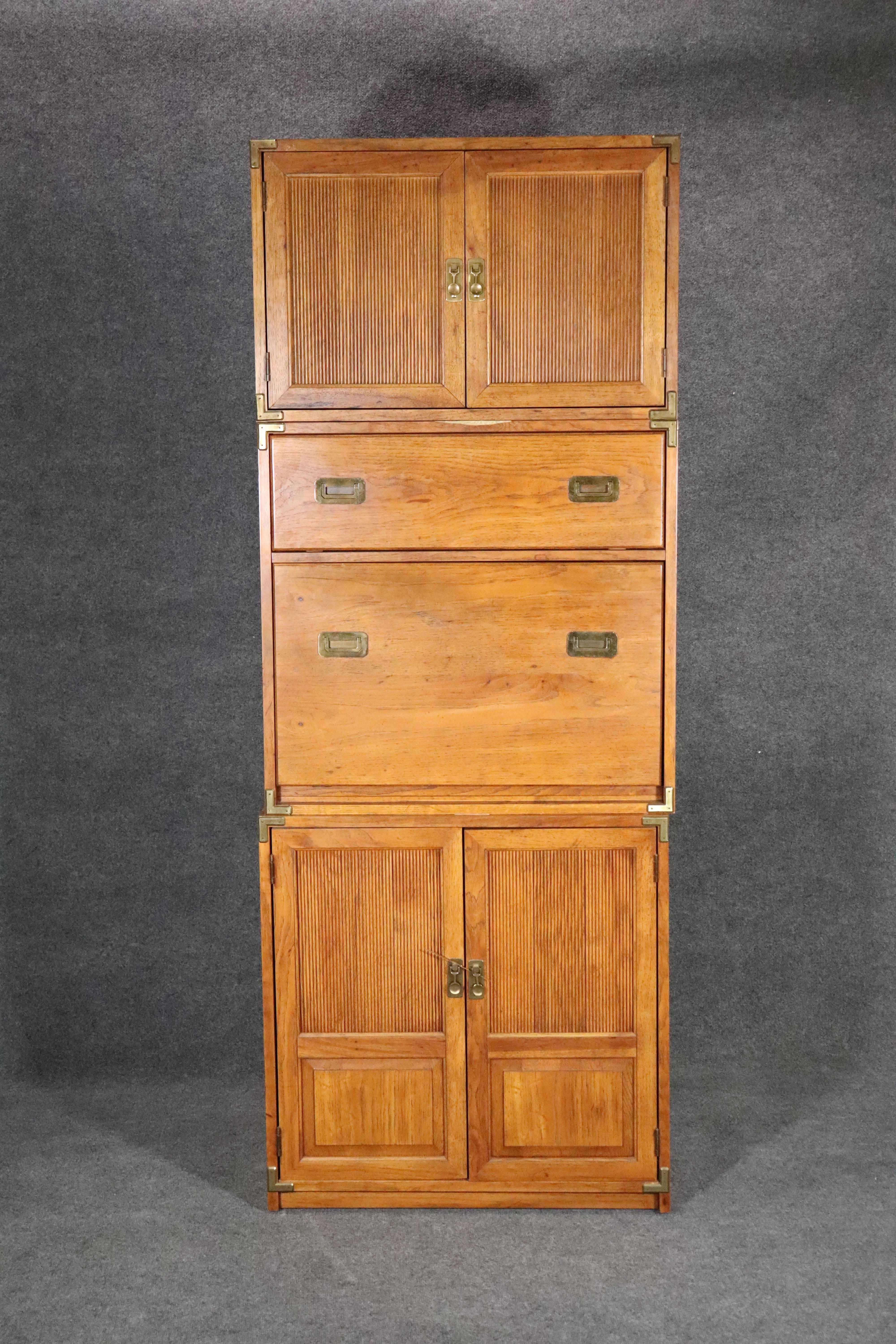Mid-century stacking cabinet with drop front desk. Attractive campaign style with brass hardware.
Please confirm location NY or NJ.