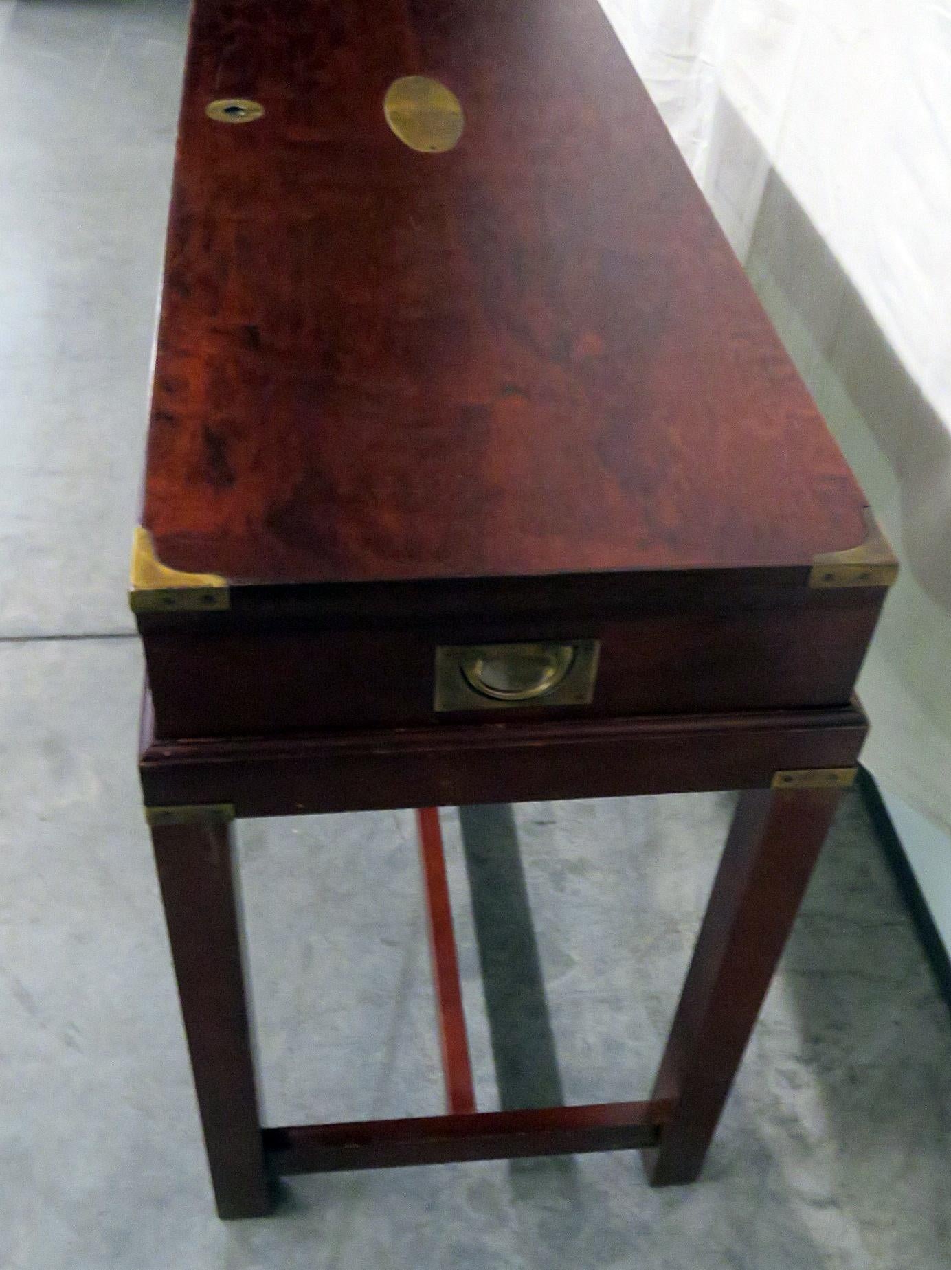 Campaign style box on stand with bronze accents.