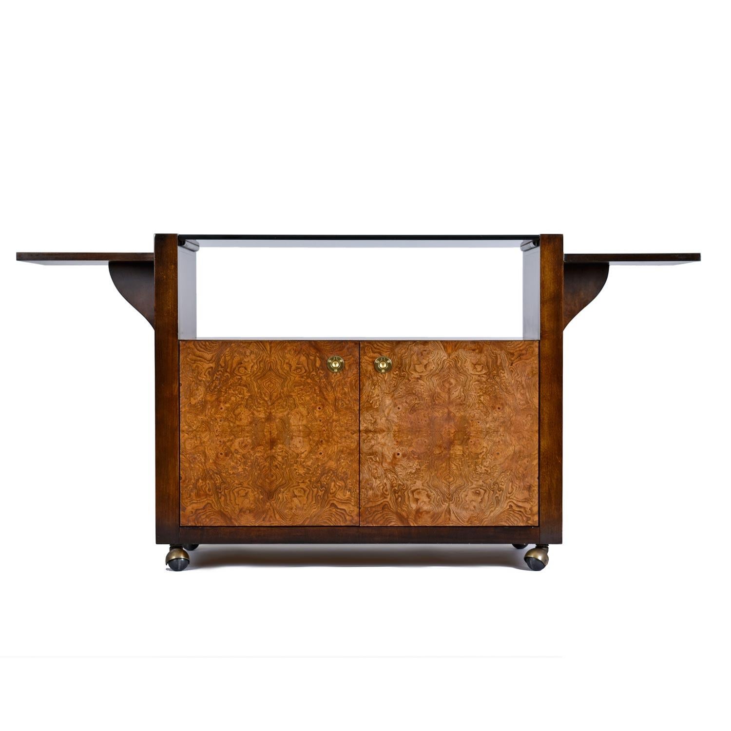 Stunning Campaign style server bar cart on casters made by esteemed US furniture maker Century, circa 1970s. Mesmerizing burl wood on front, top and back of cabinet. A thick sheet of dark, smoked glass rests on top the cabinet and can easily be