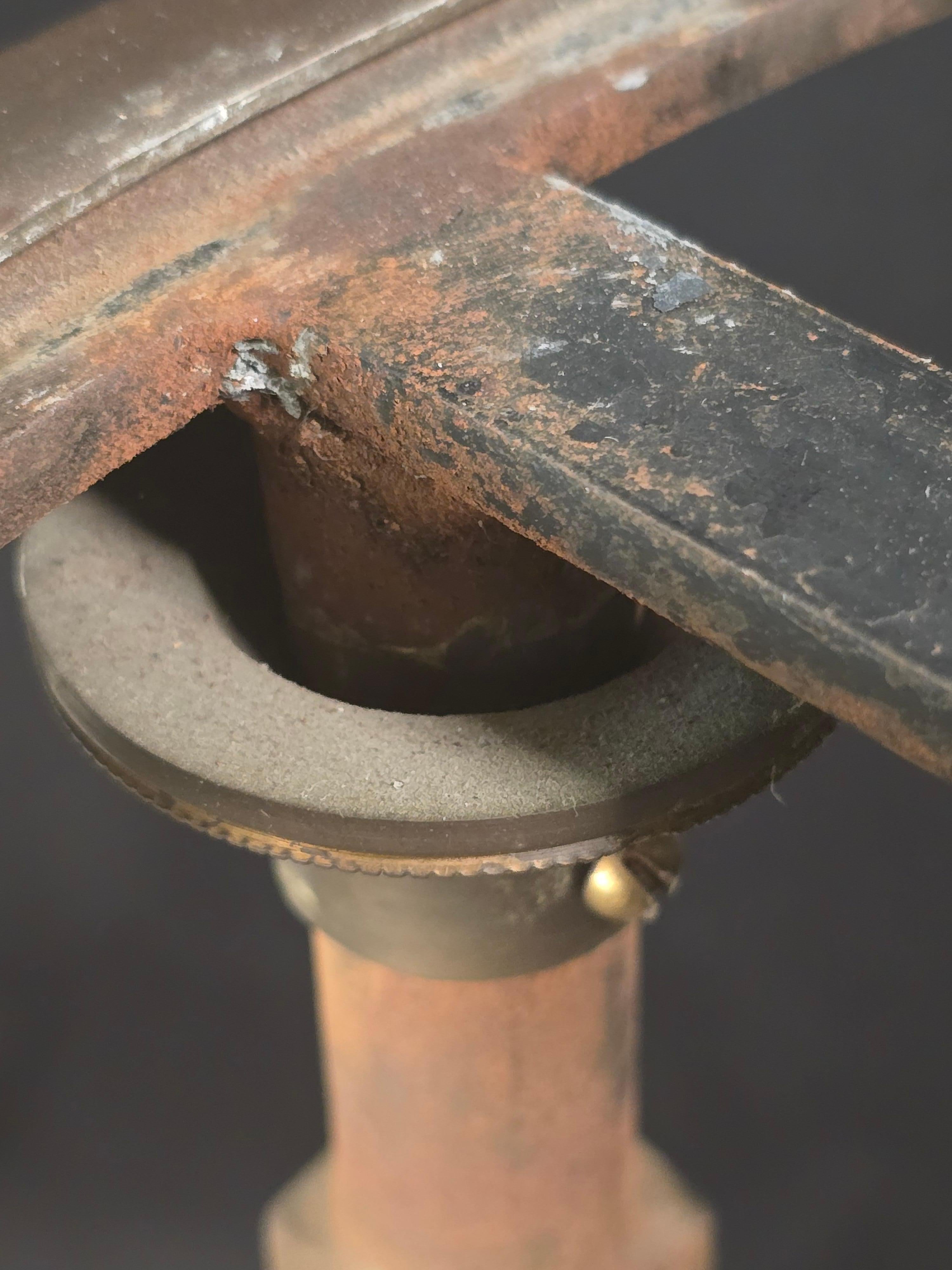 A finely crafted 1980s side table that merges the crisp geometry of campaign furniture with the refinement of Maison Jansen and the modernist glamour of John Vesey. The steel base is accented with crisply cast bronze paw feet and X-form stretchers,