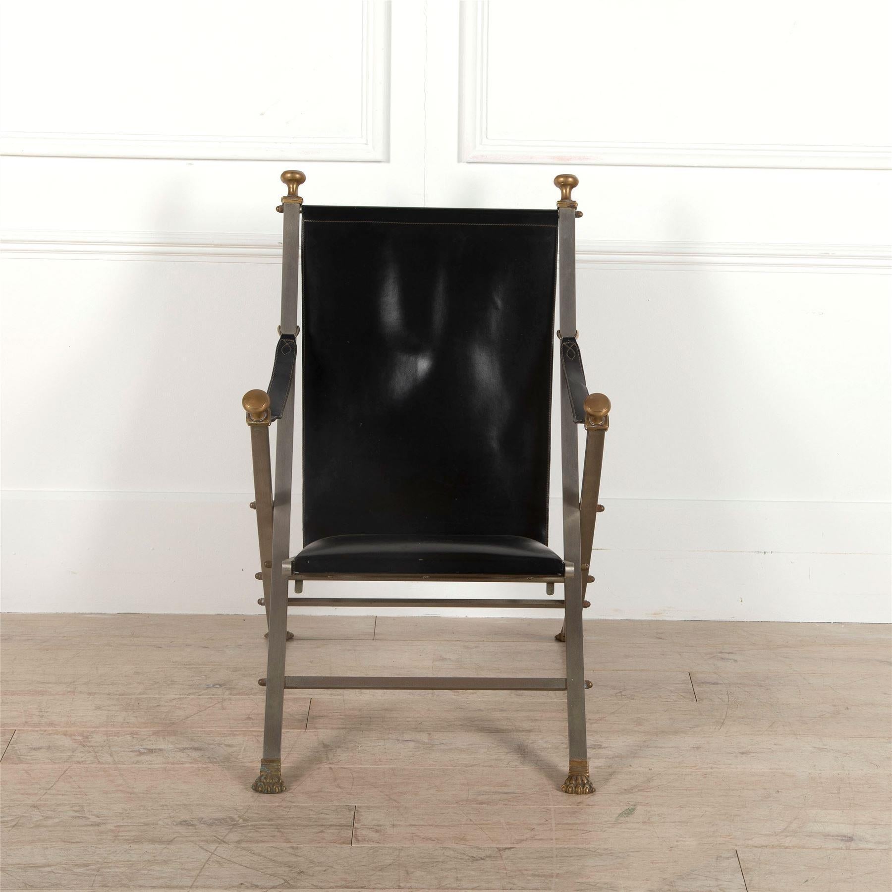 A campaign style chair by Maison Jansen.