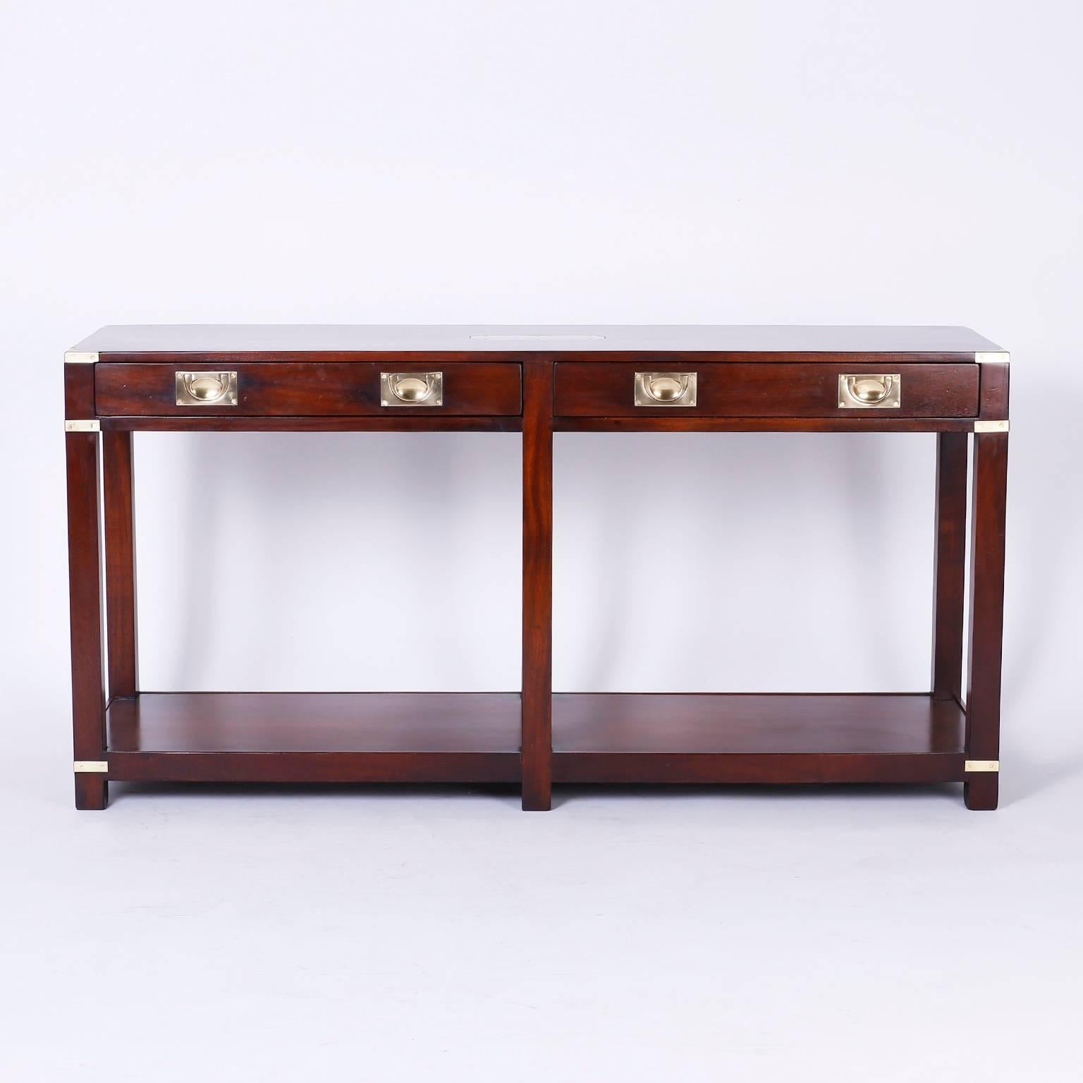 Vintage Campaign style two tiered mahogany console featuring an engravable brass plaque on the top, Campaign style brass hardware and a lower tier with dynamic possibilities.