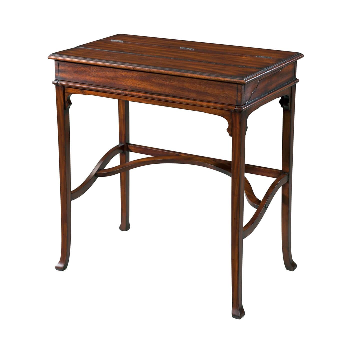 A 19th-century style Campaign desk, the flip-top revealing a fitted interior, slide-out tooled leather writing surface, raised on splayed legs with a stretcher.

Dimensions: 29.25