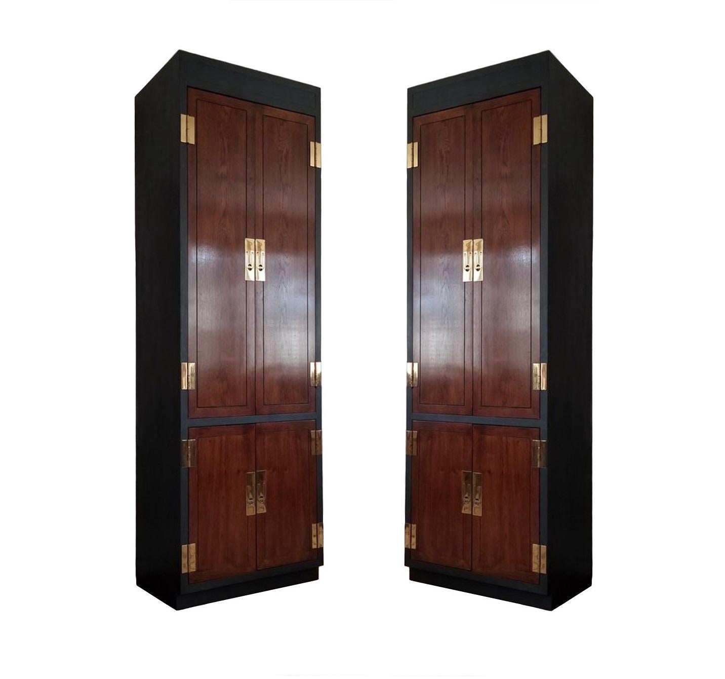 Vintage Campaign style chifforobes or cabinets, made by esteemed American manufacturer, Henredon. Part of Henredon’s early Scene One collection. Each cabinet professionally lacquered hardwood case, dark-stained fronts fitted with brass hinges and