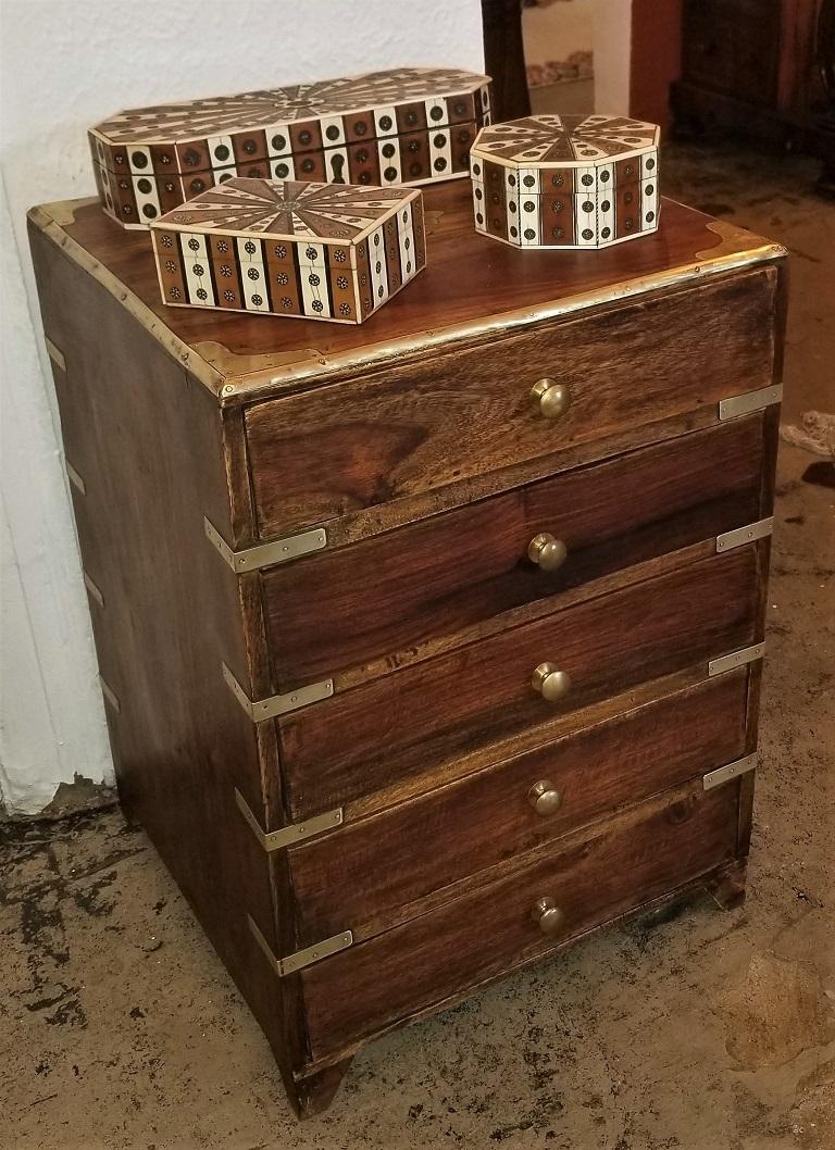 Presenting a gorgeous and beautifully proportioned Campaign style mini chest.

Late 19th century, circa 1890, probably made in Colonial India.

Perfect as a side table for a sofa or just for use as a side cabinet for storage.

5 drawers, each