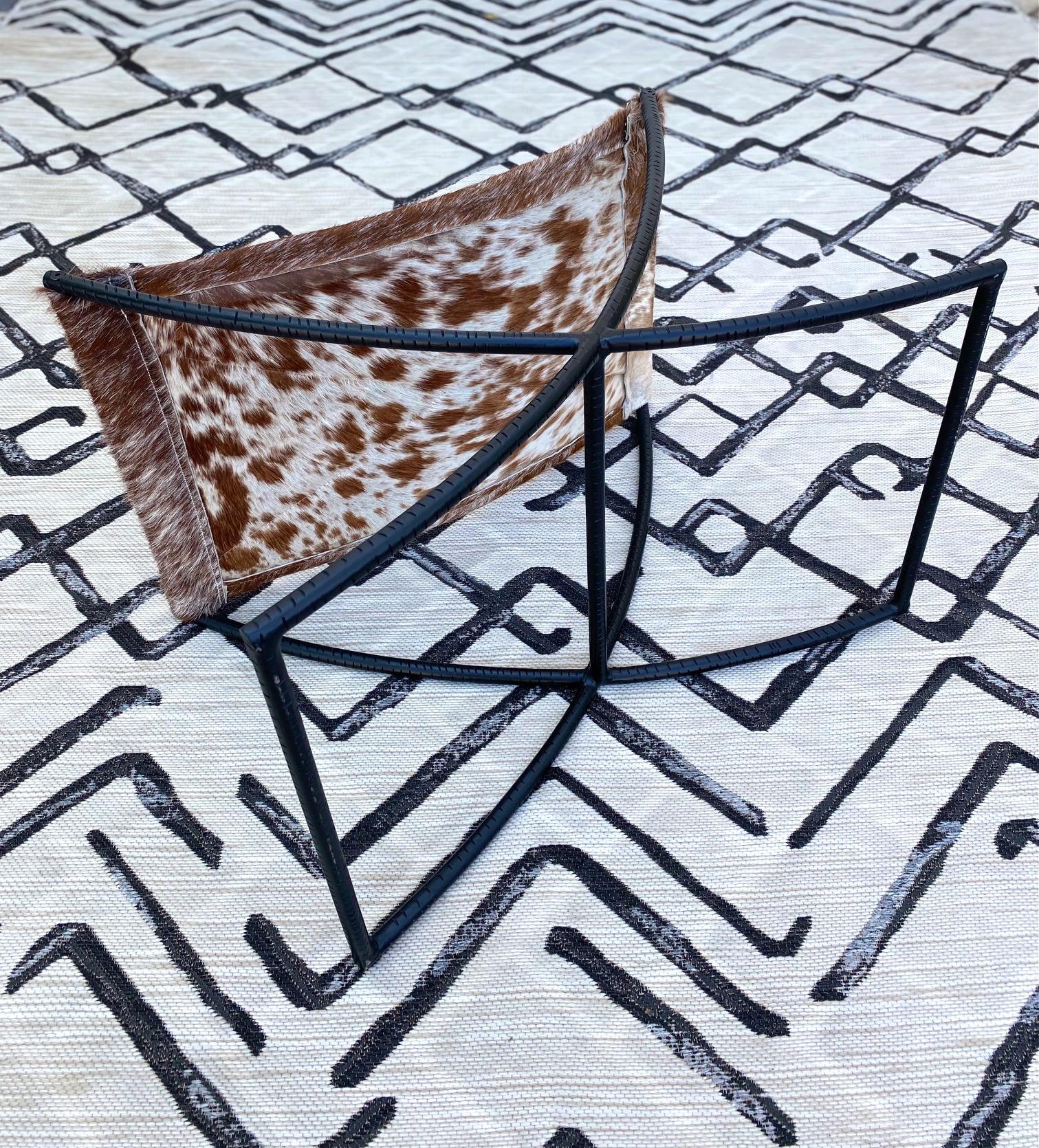 Campaign Style Stool with Brown and White Cowhide Seat and Black Iron Base 1