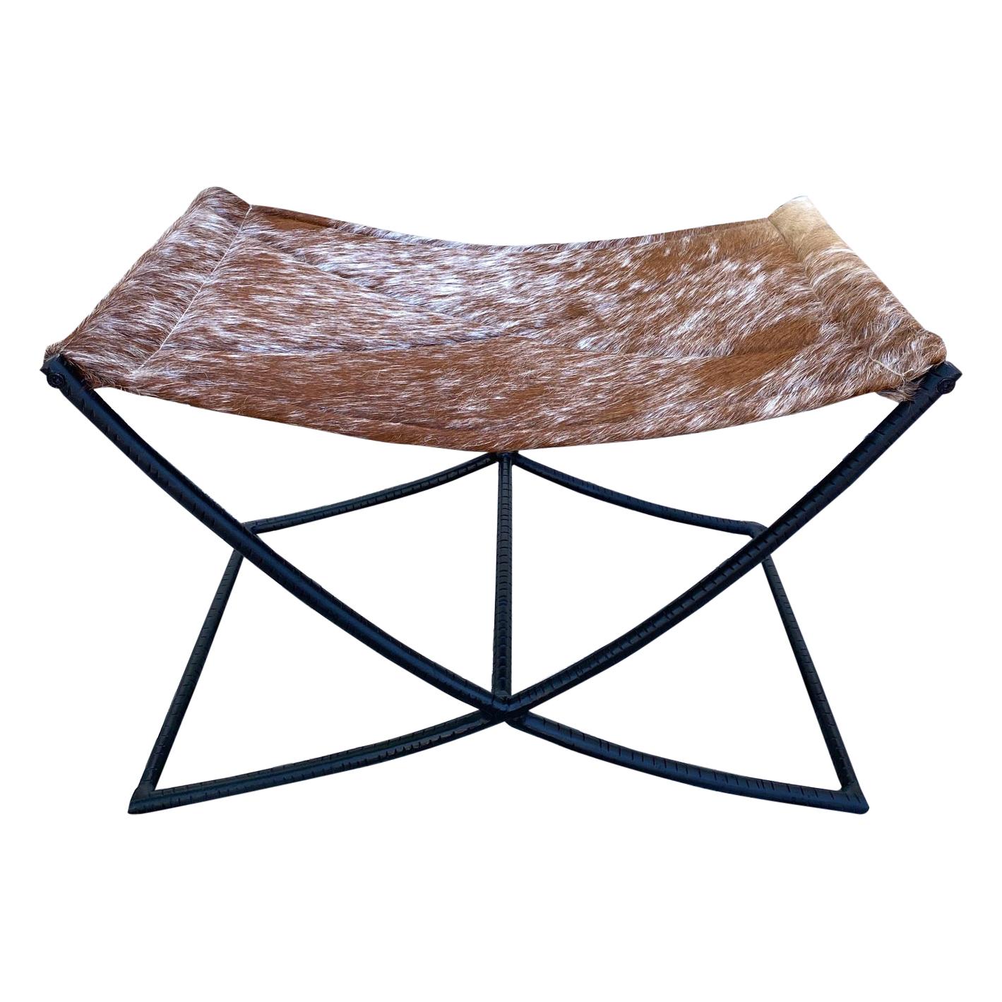 Campaign Style Stool with Brown and White Cowhide Seat and Black Iron Base