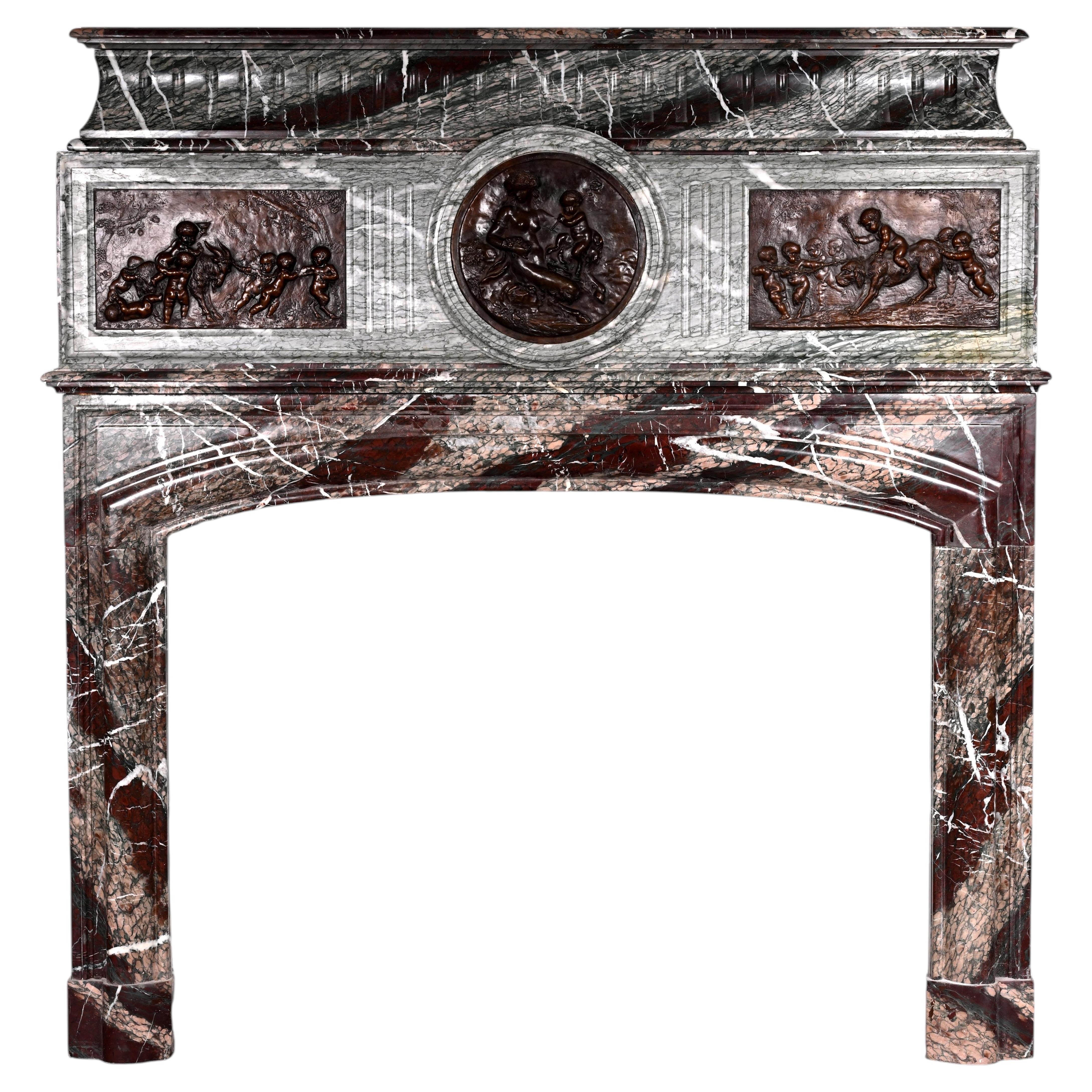 Campan marble fireplace, Louis XIV style, with bronzes after Clodion For Sale