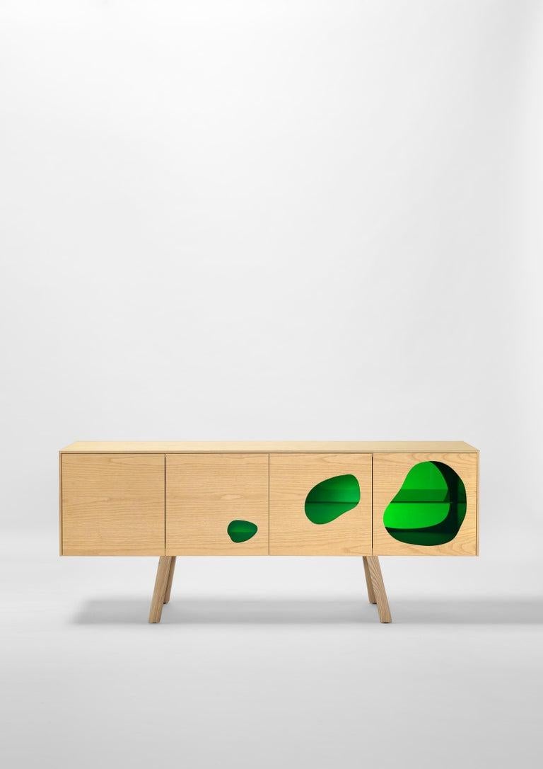 Prototype sideboard designed by Fernando and Humberto Campana in 2016
This is the first piece ever made and is unique.
Manufactured in Spain by BD Barcelona Design.

The Campana brothers chose the colored glass to give the impression of a fish