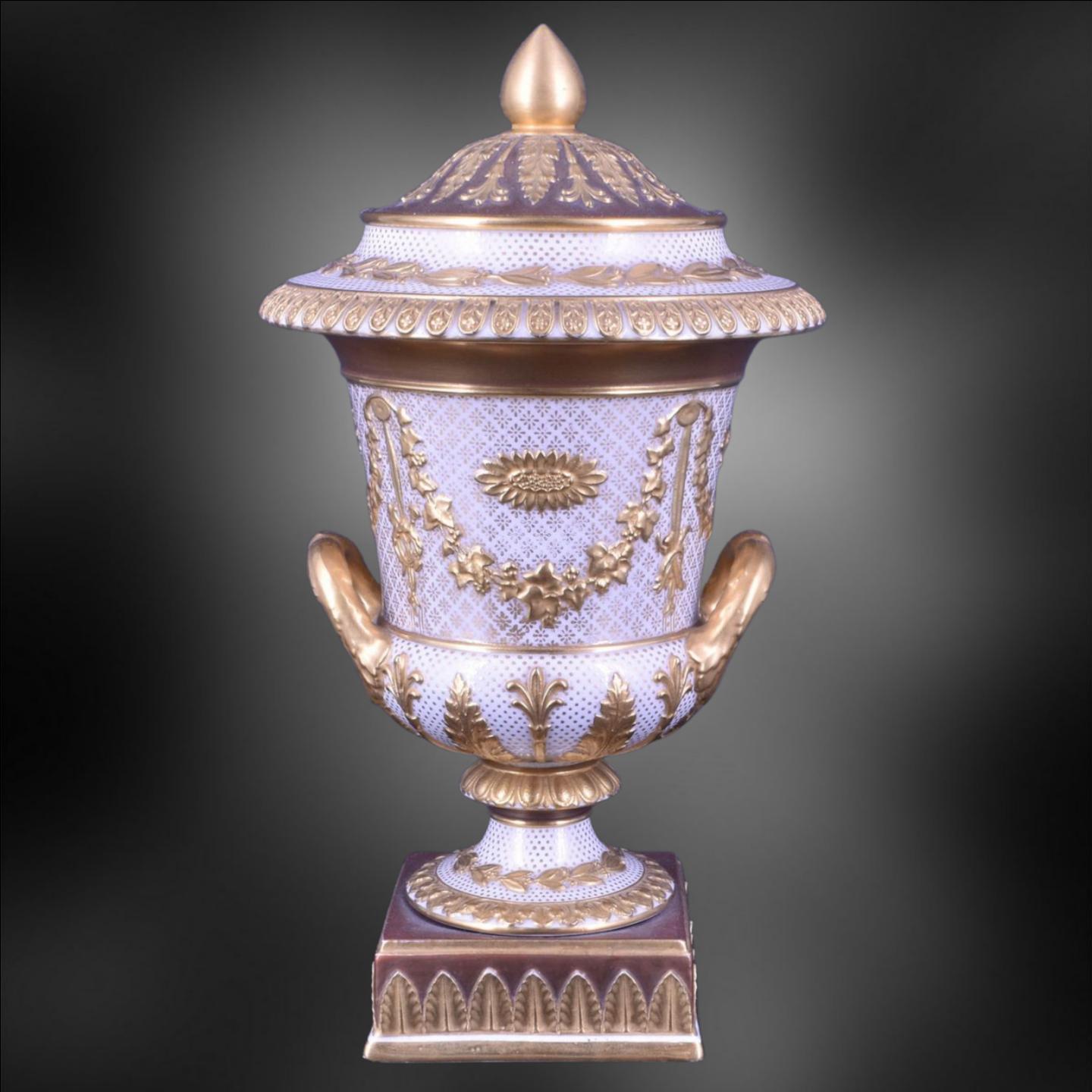 A marvellous combination of Wedgwood's traditional neoclassical style, in the form of a campana vase; which has been decorated in High Victorian style with gilt and bronzing.

