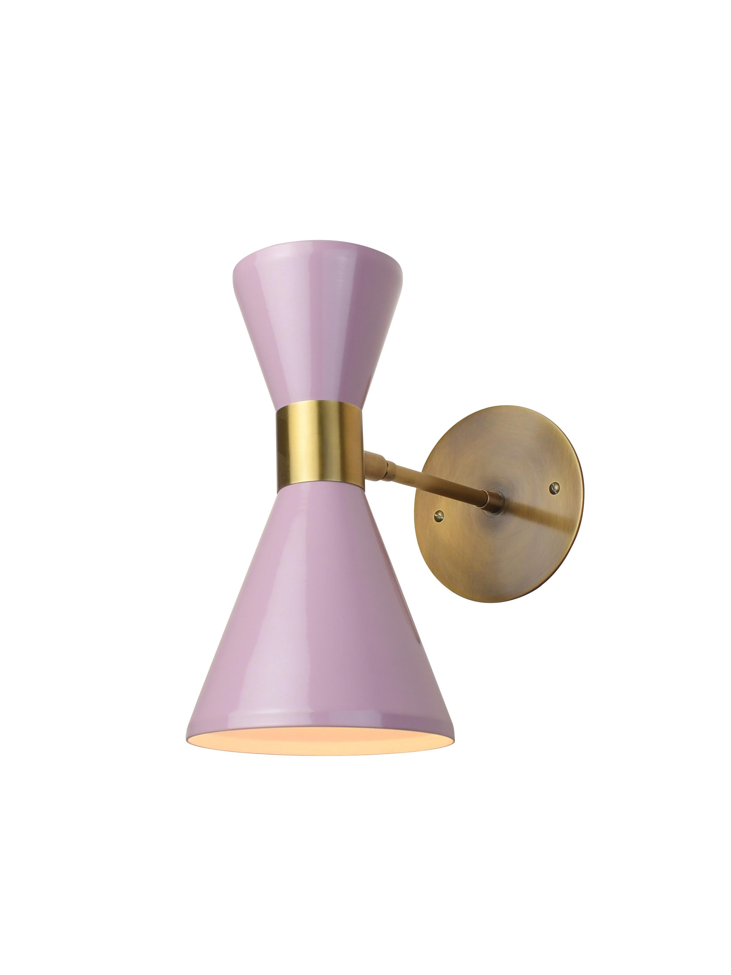 The Campana wall sconce or reading light shown in brushed brass and lilac enamel by Blueprint Lighting, 2018. The wide band and distinctly bevelled edge makes the Campana a strong design statement. Swiveling head allows for cone adjustment. The spun