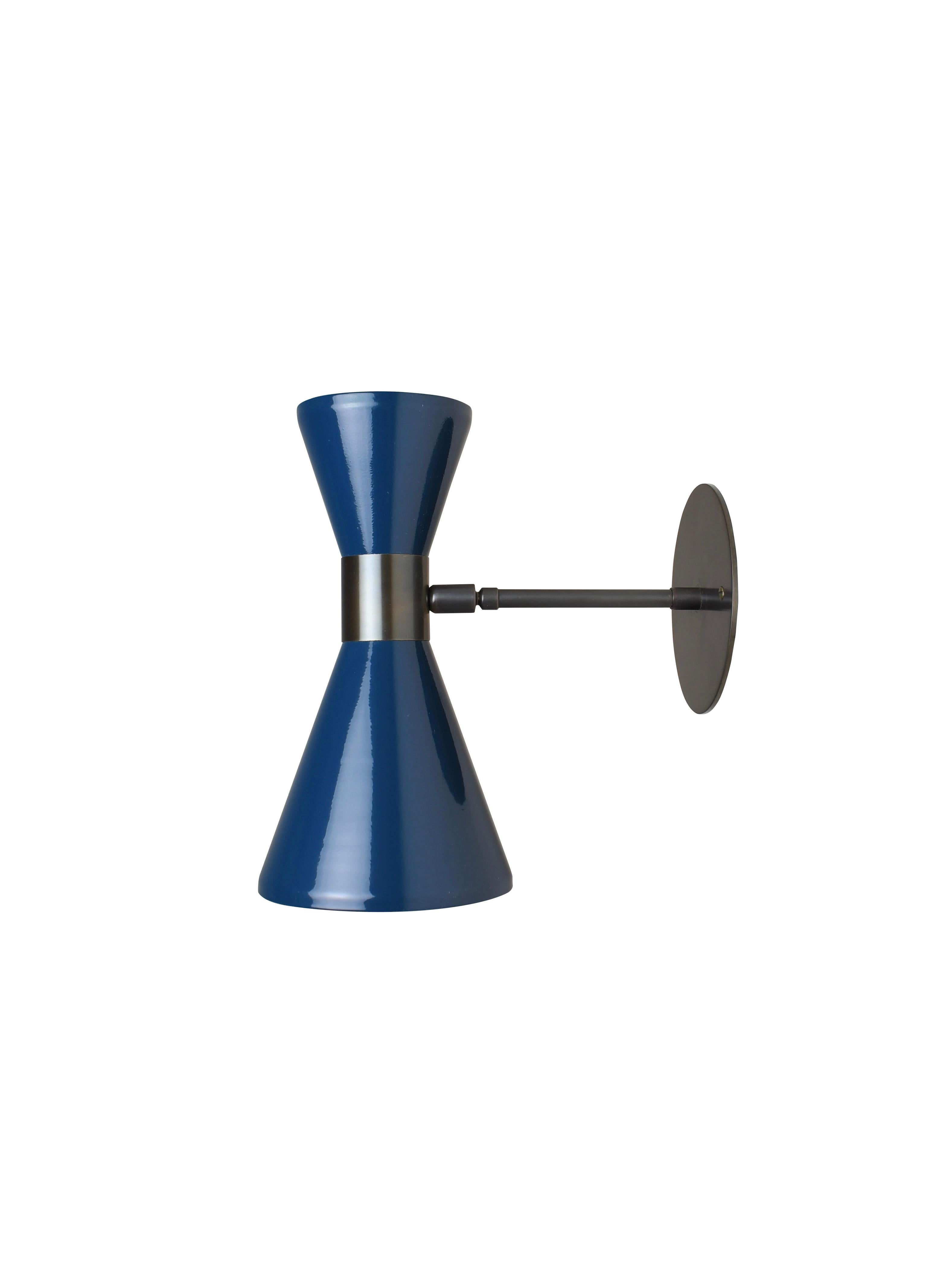 The Campana wall sconce or reading light shown in oil-rubbed bronze and dark blue enamel by Blueprint Lighting, 2018. The wide band and distinctly bevelled edge makes the Campana a strong design statement. Swiveling head allows for cone adjustment.