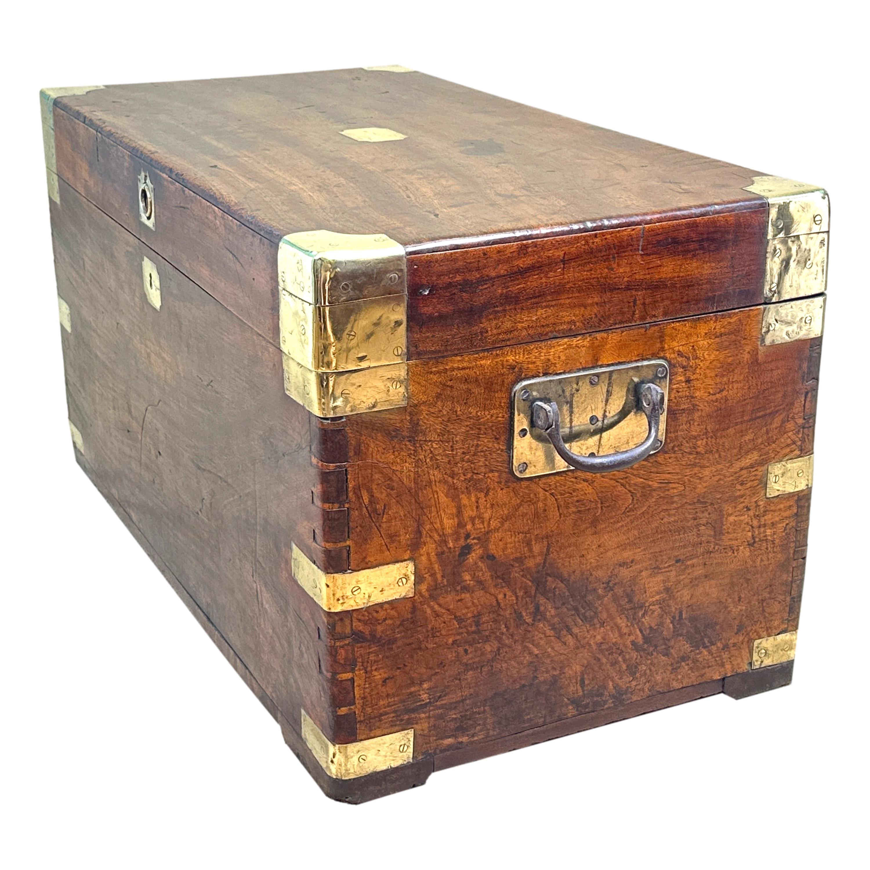 A Charming Mid 19th Century Camphor Wood Military Campaign Trunk, Retaining Good Rich Colour And Patina Throughout, Having Hinged Lid Enclosing Storage, Original Brass Bound Decoration And Original Carrying Handles.


Its widely accepted that trunks