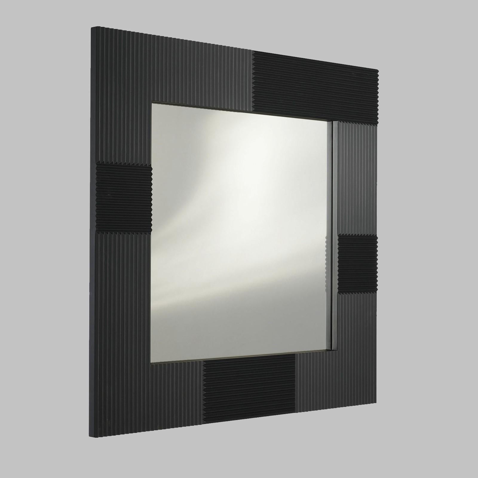 Combining a simple silhouette with a striking surface, this modern mirror will enrich a contemporary home. Either placed above a mantelpiece, in an entryway, or over a sink in a powder room, this piece will frame a wall with sophistication,