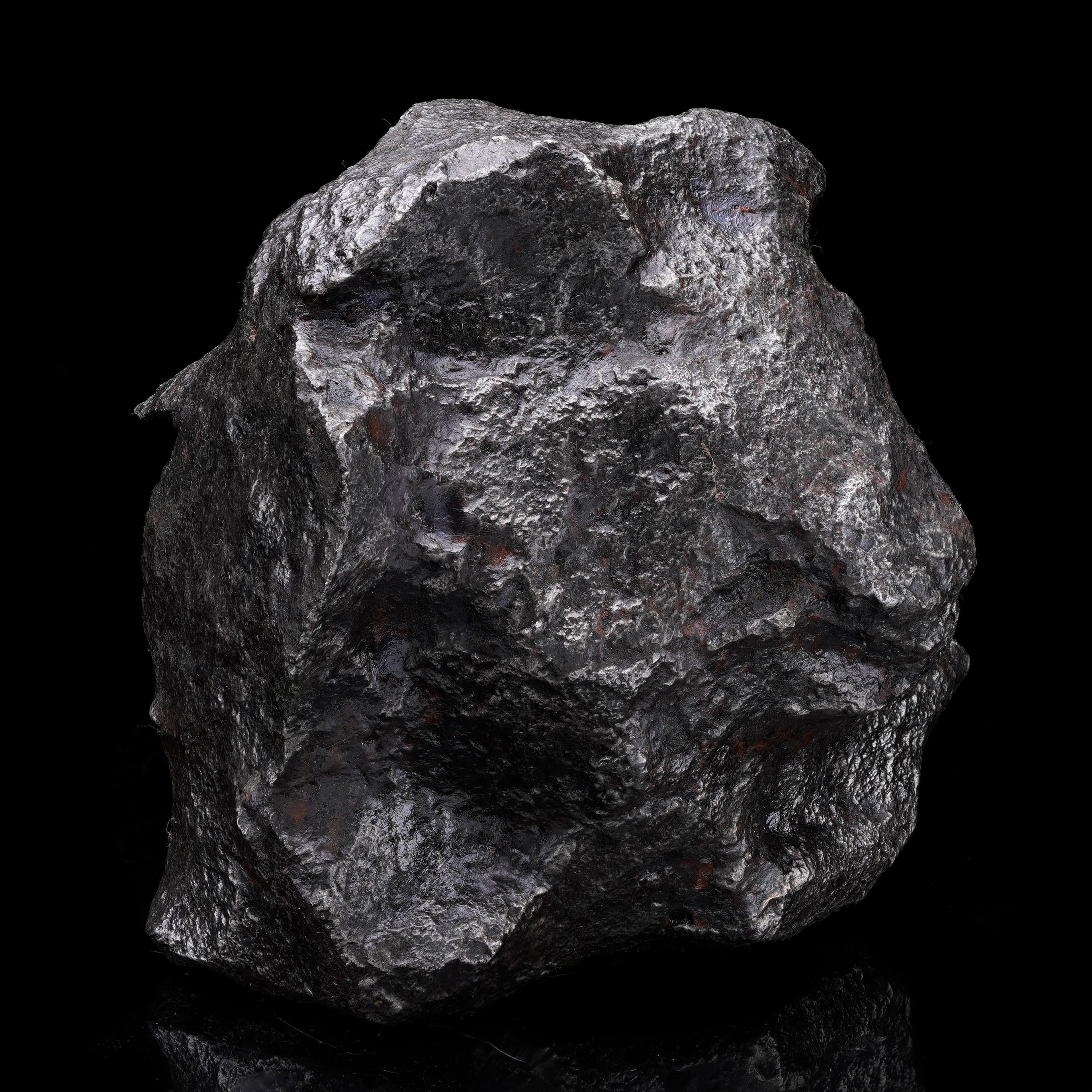This massive Campo del Cielo meteorite weighs in at over 30 lbs. (and over 13,900 grams) and features a unique sculptural shape created by the presence of numerous regmaglypts or thumbprints. Regmalypts are a sought-after feature for meteorite