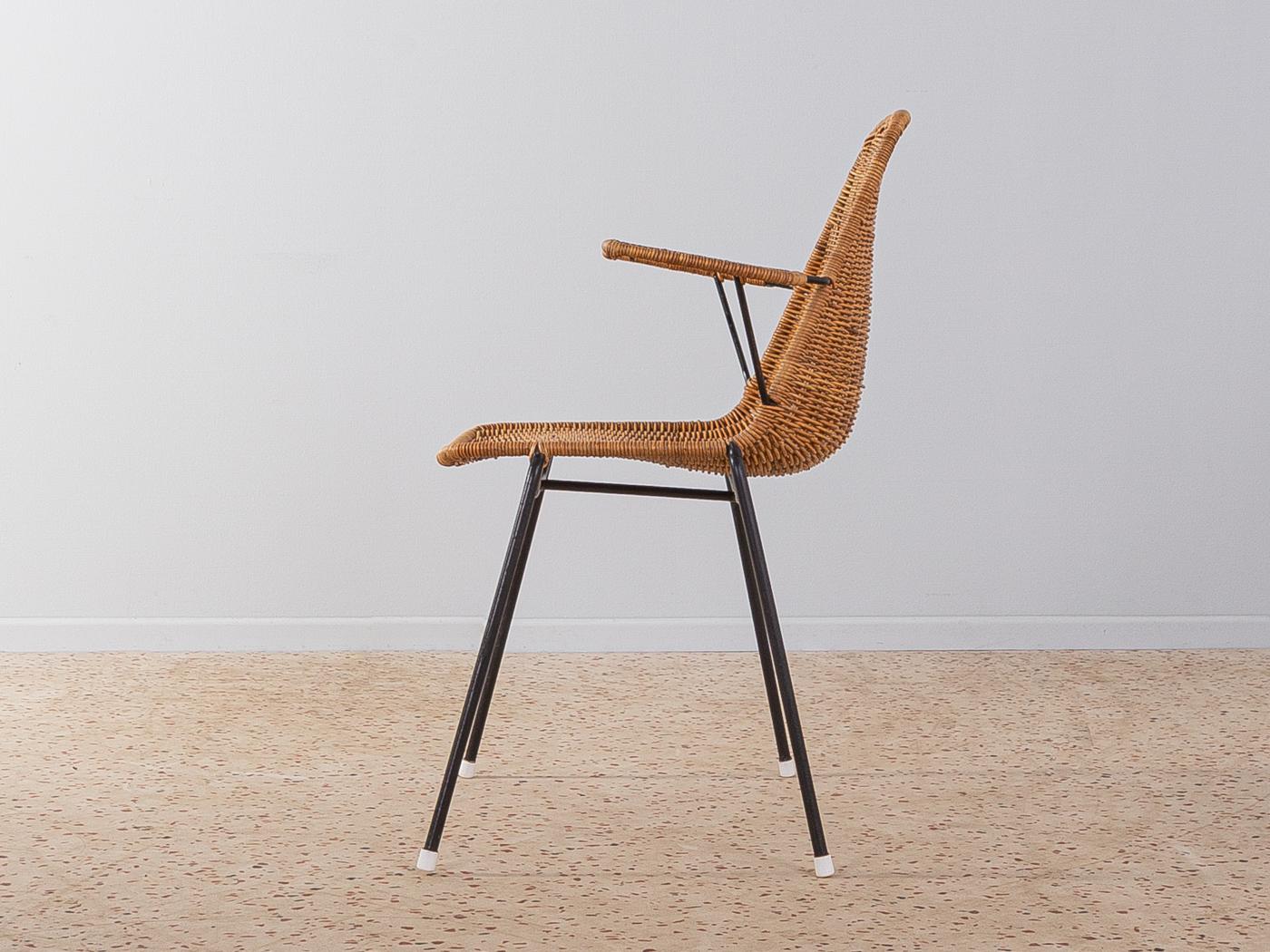 Wonderful wicker chair by Franco Campo & Carlo Graffi from the 1950s. Black steel frame with wicker seatshell and armrests.

Quality Features:
    good workmanship
    high-quality materials
    Made in Italy. Design: Franco Campo & Carlo Graffi