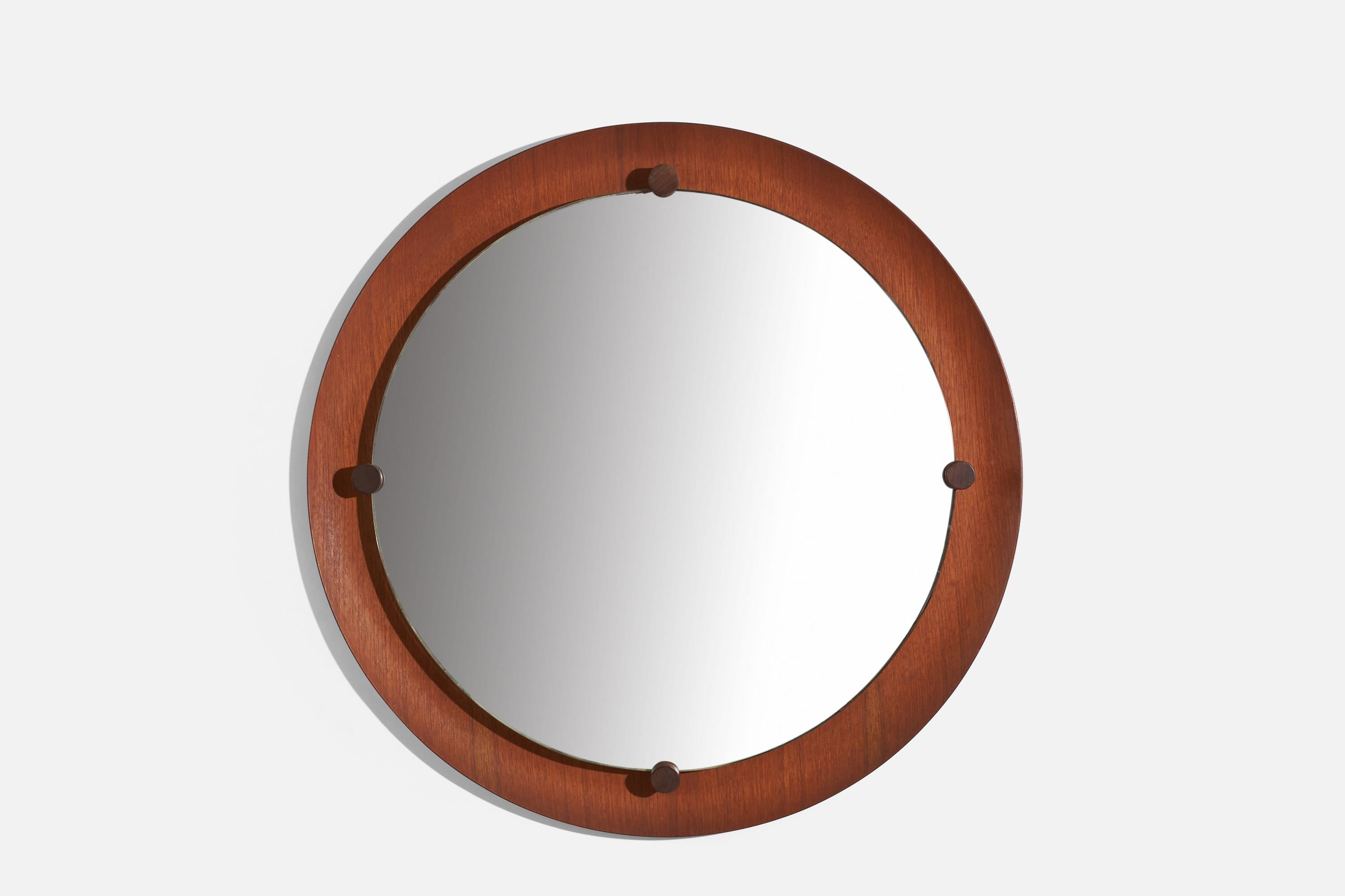 A brass and teak wall mirror design attributed to Franco Campo and Carlo Graffi, presumably manufactured by Home, Italy, 1950s-1960s.
 