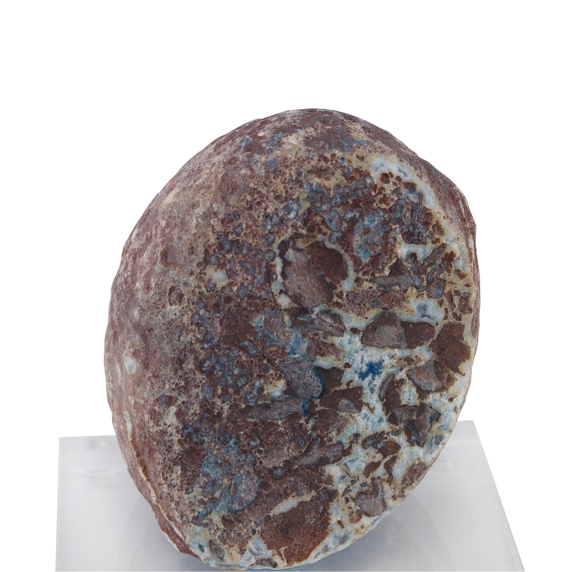 A blue agate geode mounted on a clear acrylic base. Due to the natural material, variation in size, shape, and color is to be expected.
       