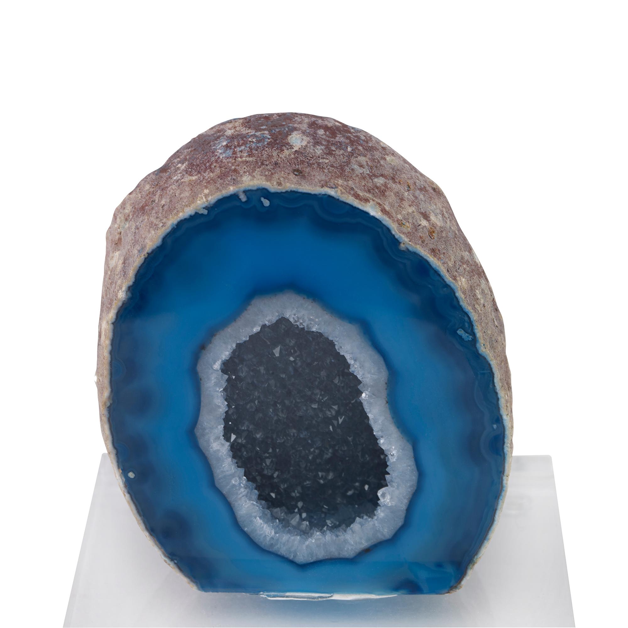 A blue agate geode mounted on a clear acrylic base. Due to the natural material, variation in size, shape, and color is to be expected.