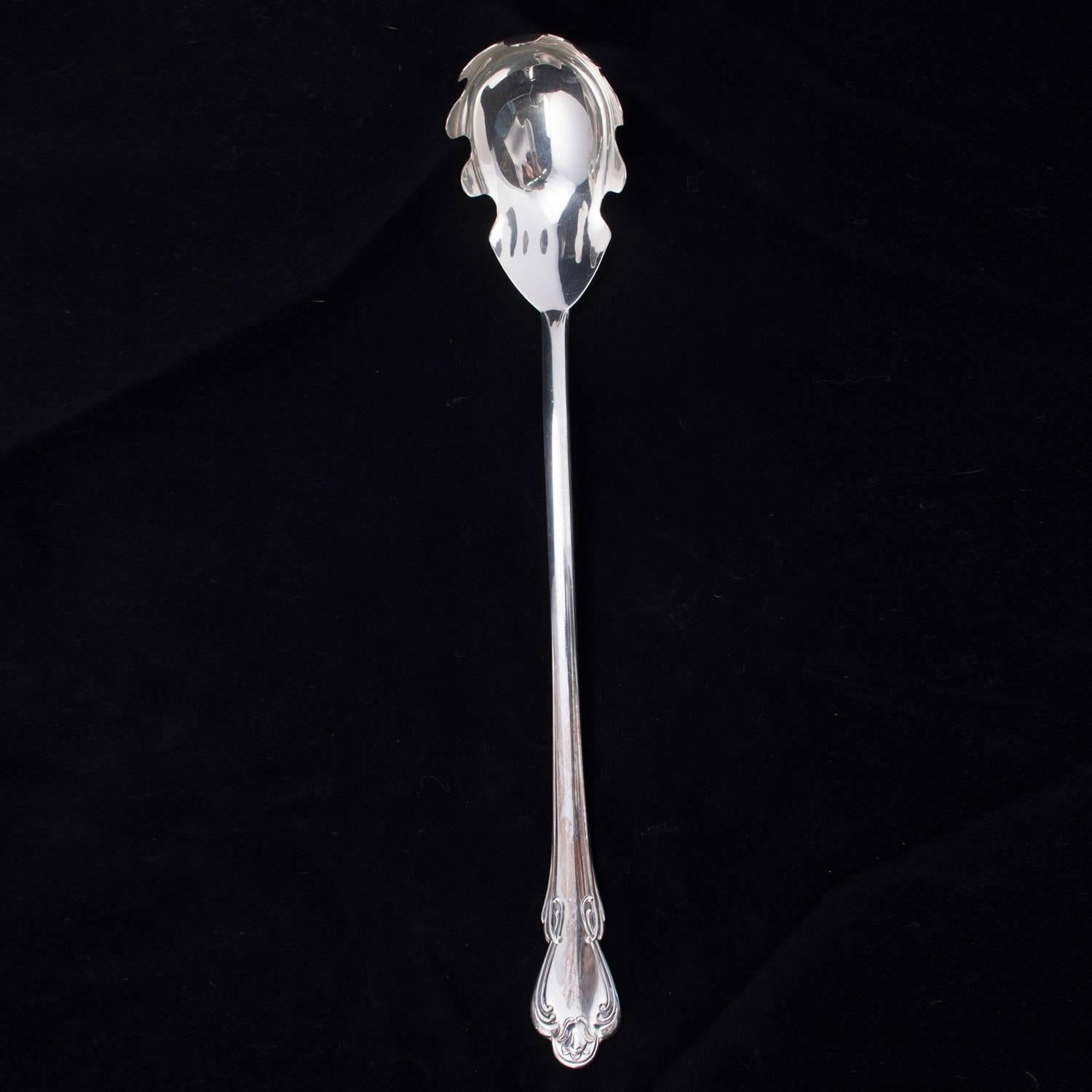 Camusso sterling silver pasta server features scroll decorated handle , en verso marked 