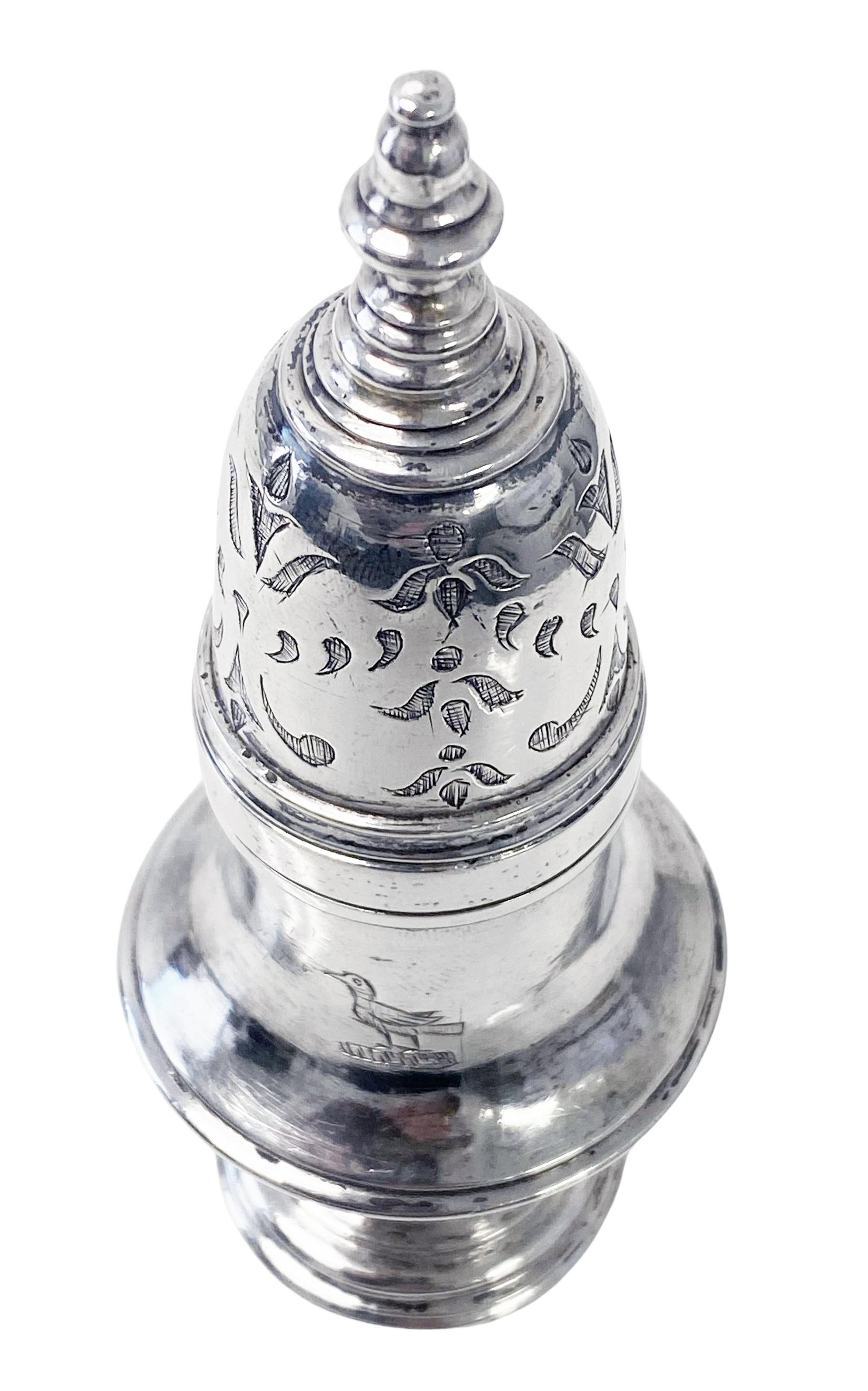 Canadian 18th century Silver Caster Pierre Huguet dit Latour C.1770 with silversmith mark for Michel Fortin Quebec. This blind caster (sleeved for dry mustard) of baluster form, the foliate decorated cover with plain knopped finial, the lower body