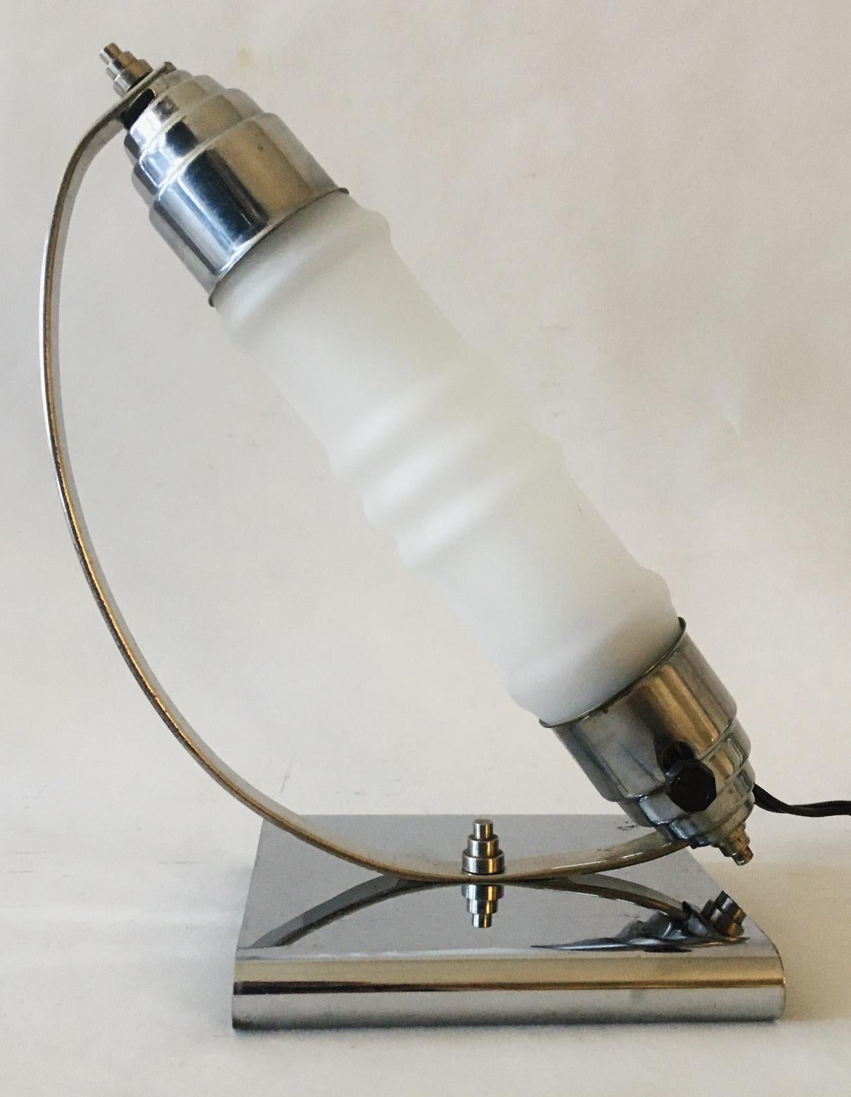 This Canadian Art Deco chrome and frosted glass table lamp was manufactured by the Florentine Lamp Company of Toronto, Ontario, Canada which ceased production in 1940 after the principal was interned by the Canadian government as an enemy alien. The