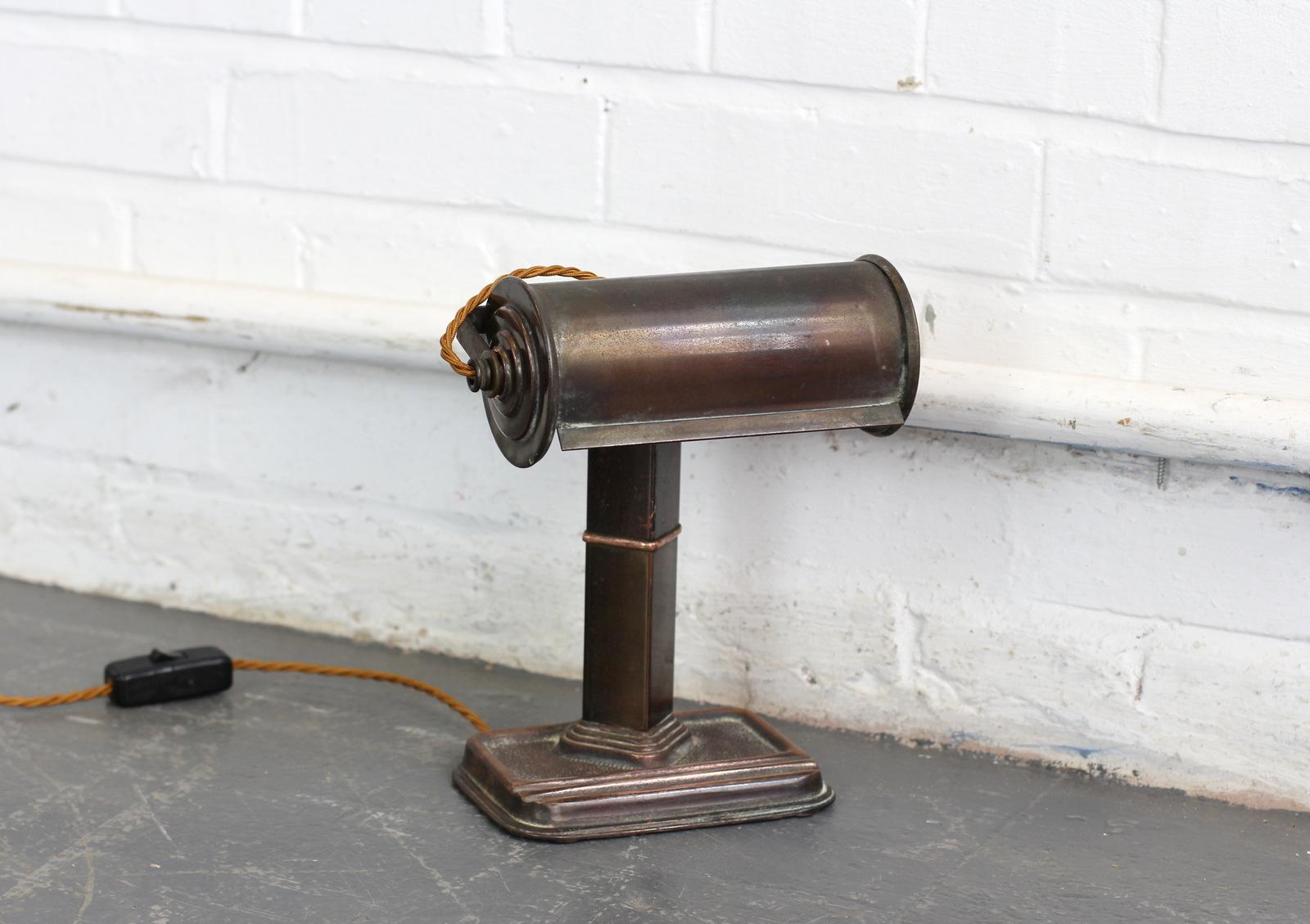 Canadian Art Deco copper desk lamp, circa 1920.

- Copper body and shade
- Cast iron base
- Re wired with gold twist cable
- Takes B22 bayonet fitting bulbs
- Canadian, circa 1920s.
- Measures: 20cm wide x 11cm deep x 26cm tall.

Condition