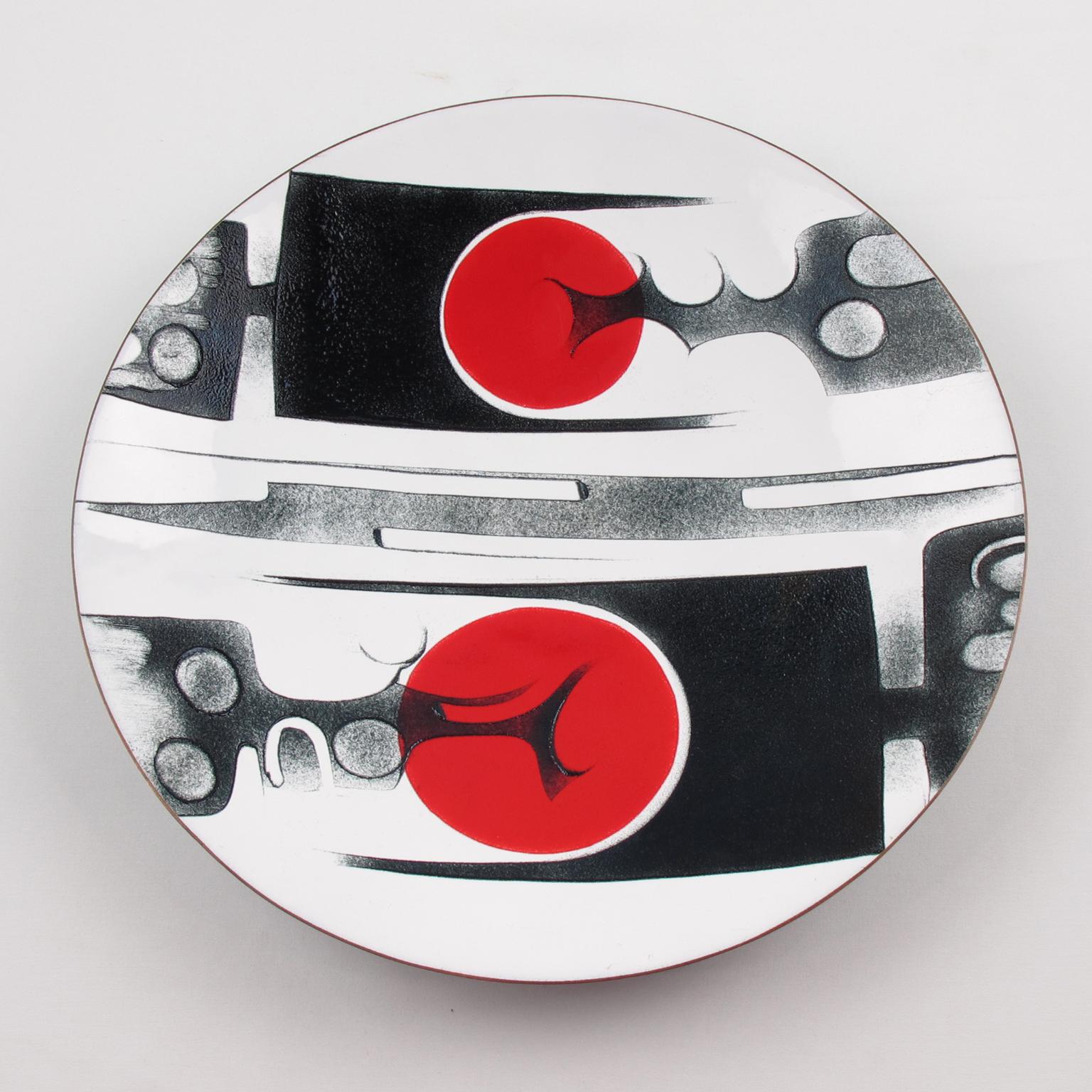 Stunning Mid-Century modernist 1970s enameled plate by Canadian Quebec artist, Anita Trottier. Abstract design with brutalist contrast in red and black colors on an extra white background. Anita Trottier created a highly stylized abstracted