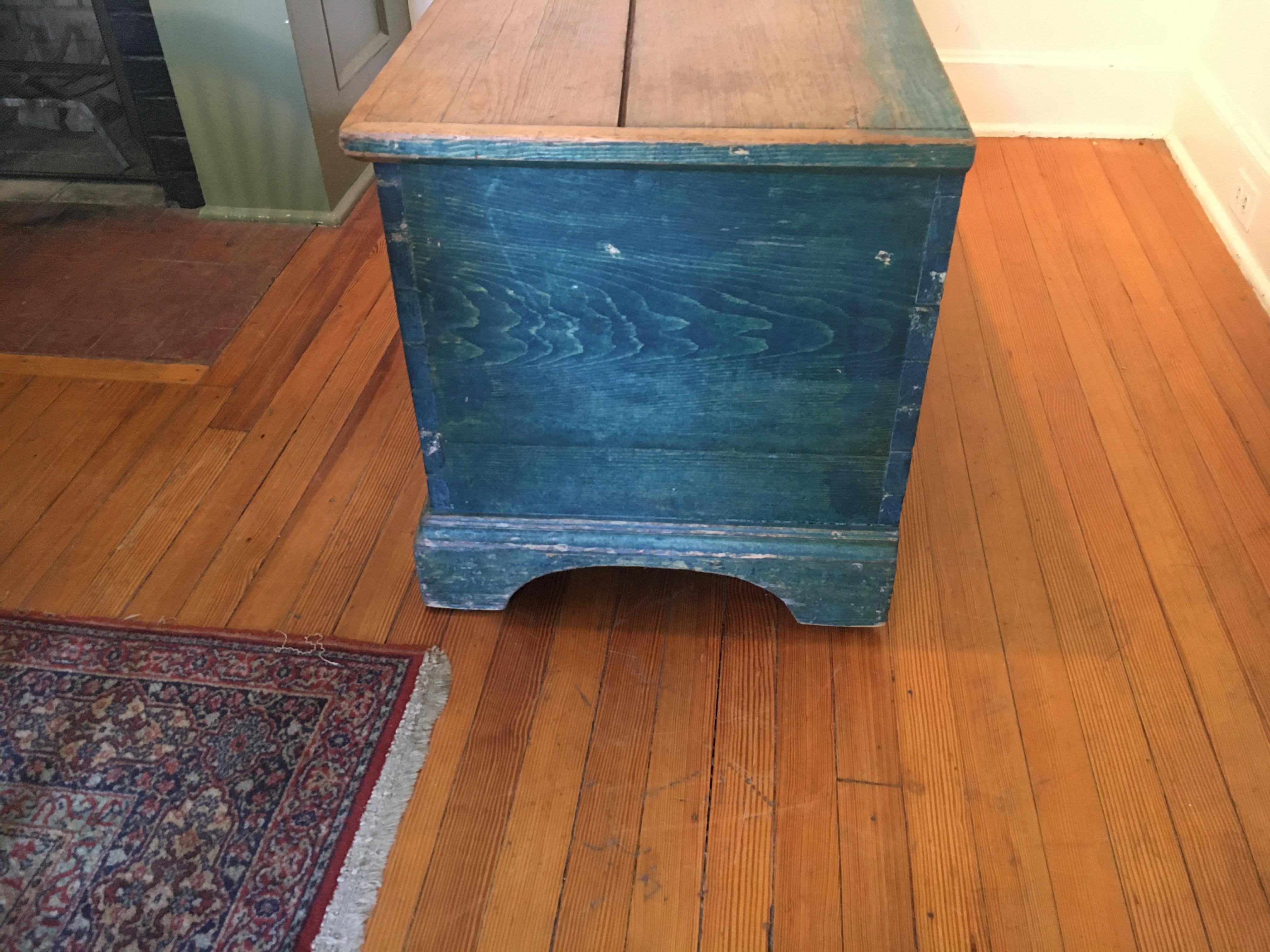 This gorgeous blue color blanket chest would either look wonderful at the foot of a bed or as a coffee table. the inside has a candle box holder and the top has been worn from much use and the special pine color shows perfectly to contrast the