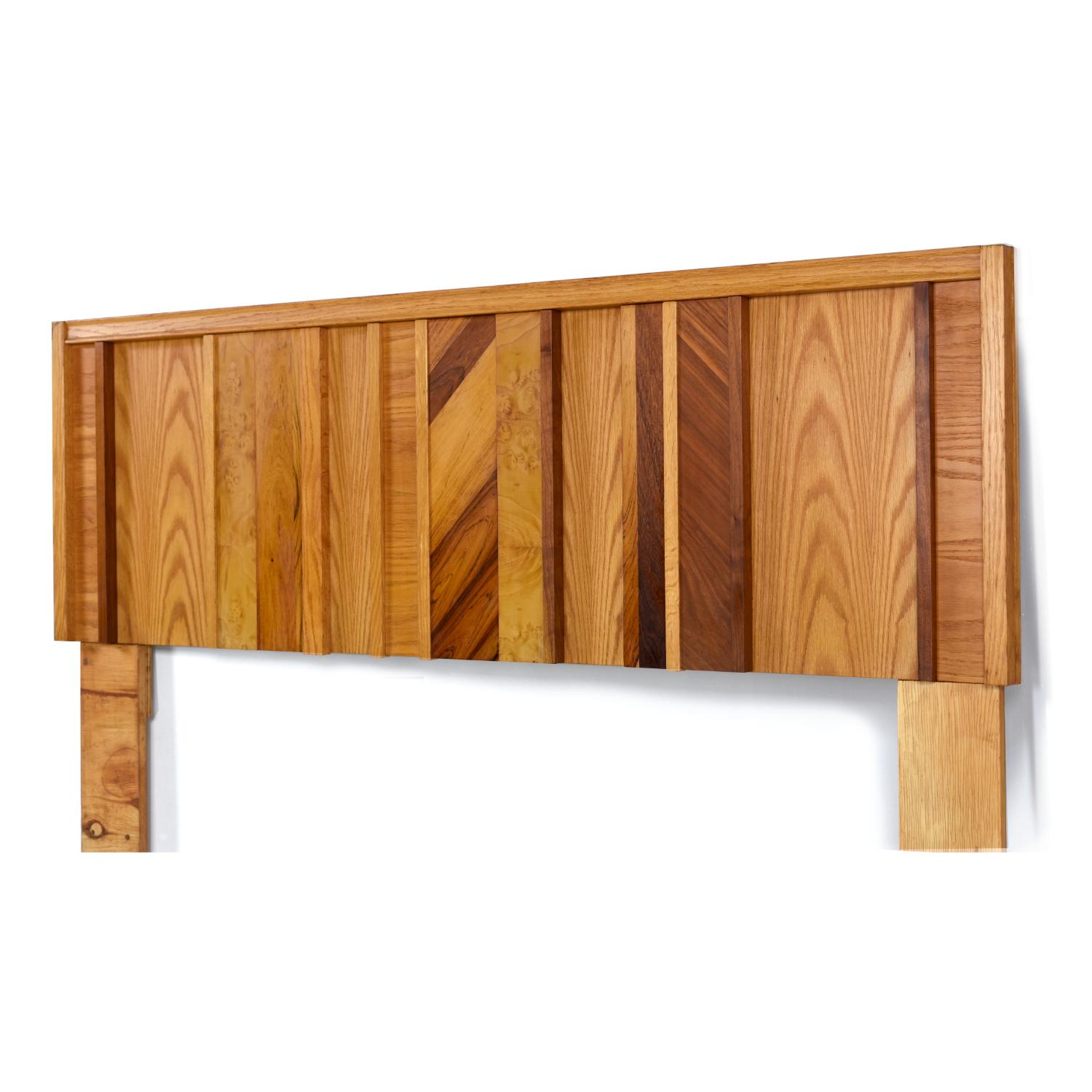 Made by Tabago Furniture Ltd. of Quebec, Canada, this brutalist headboard uses several species of wood to create a truly unique look. The magpie assortment of veneers include oak, burl wood, rosewood and walnut. The main body of the piece is a honey