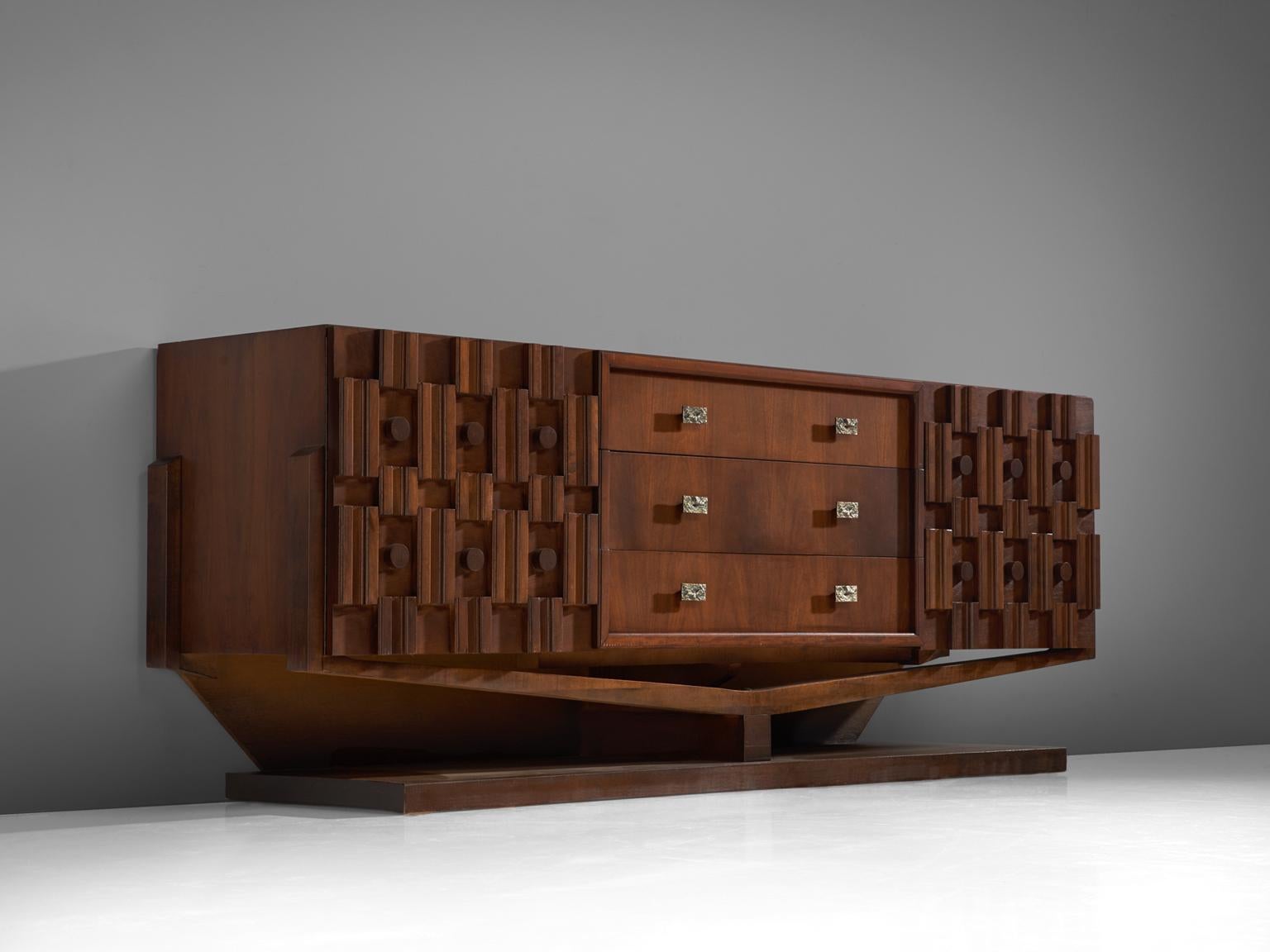 Credenza, walnut, marble and brass, Canada, 1940s. 

Large Art Deco sideboard in walnut and brass. This heavy Brutalist credenza seems to float on its elegant, geometric base with stunning bronze detailing. The credenza is equipped with three
