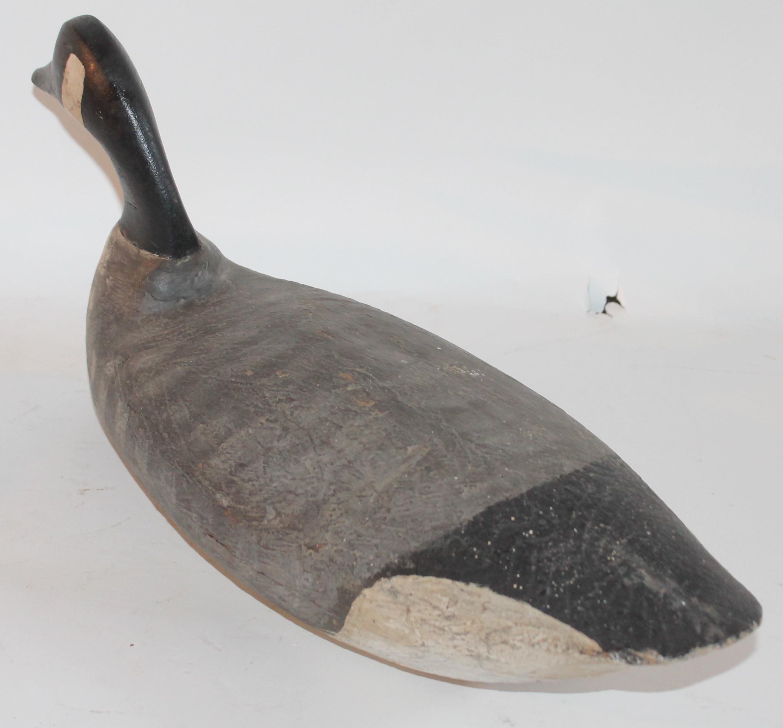 Jersey Canadian Goose wooden Rooster Ant. Cape may CH NJ 66490 This finely carved and original painted goose is a great example of folk art as well. This goose has a leather weight on its base and is original to the piece. Condition is very good.
