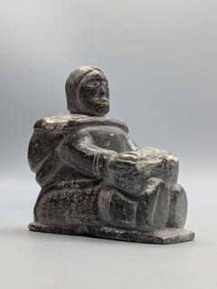 Canadian Inuit Soapstone Figure of a Woman Making a Kamik by Lydia Anautak Qumak