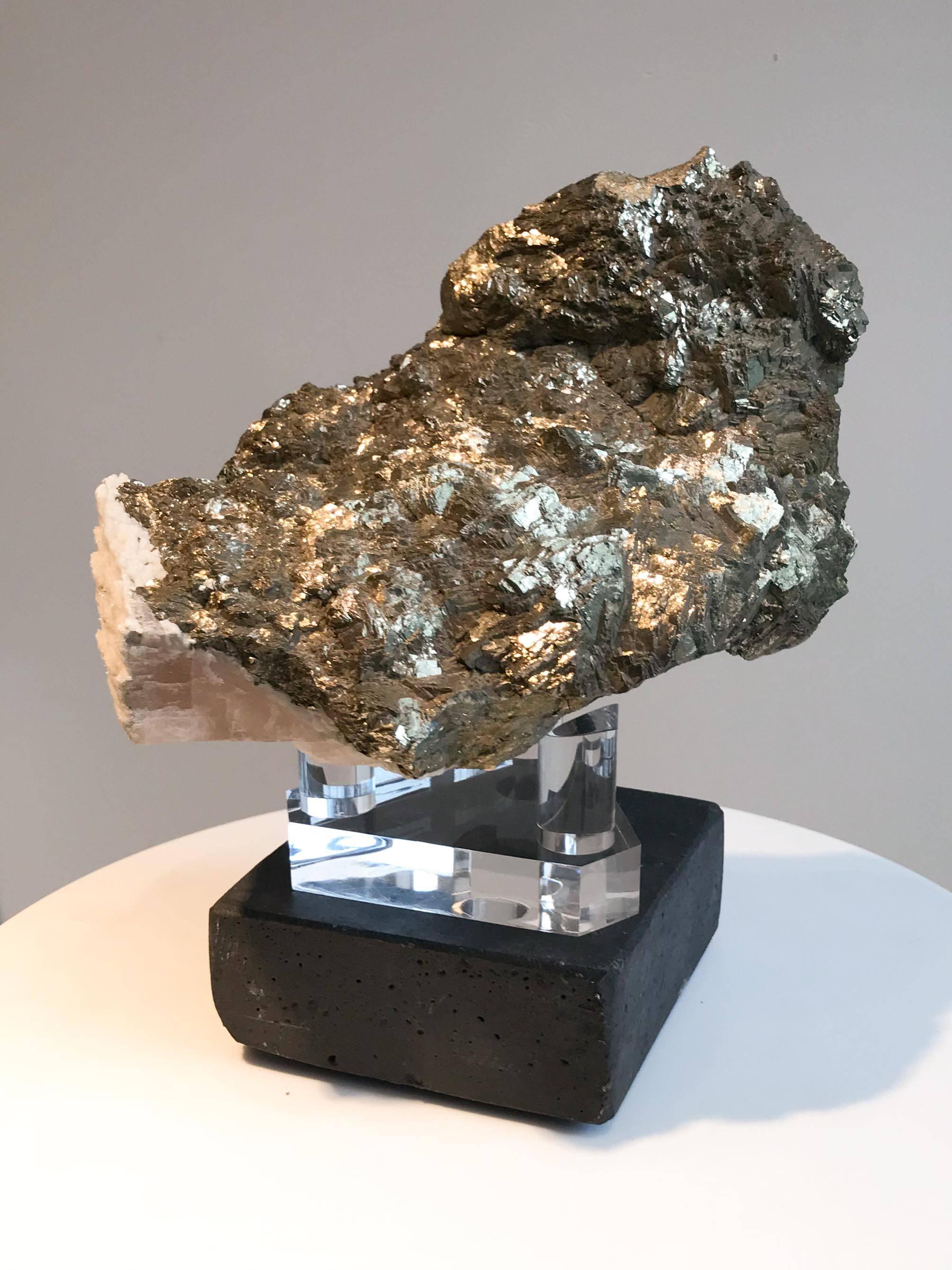 Canadian pyrite specimen on Lucite stand. Pyrite is said to be an excellent shielding stone and thought to bring abundance into one's life.