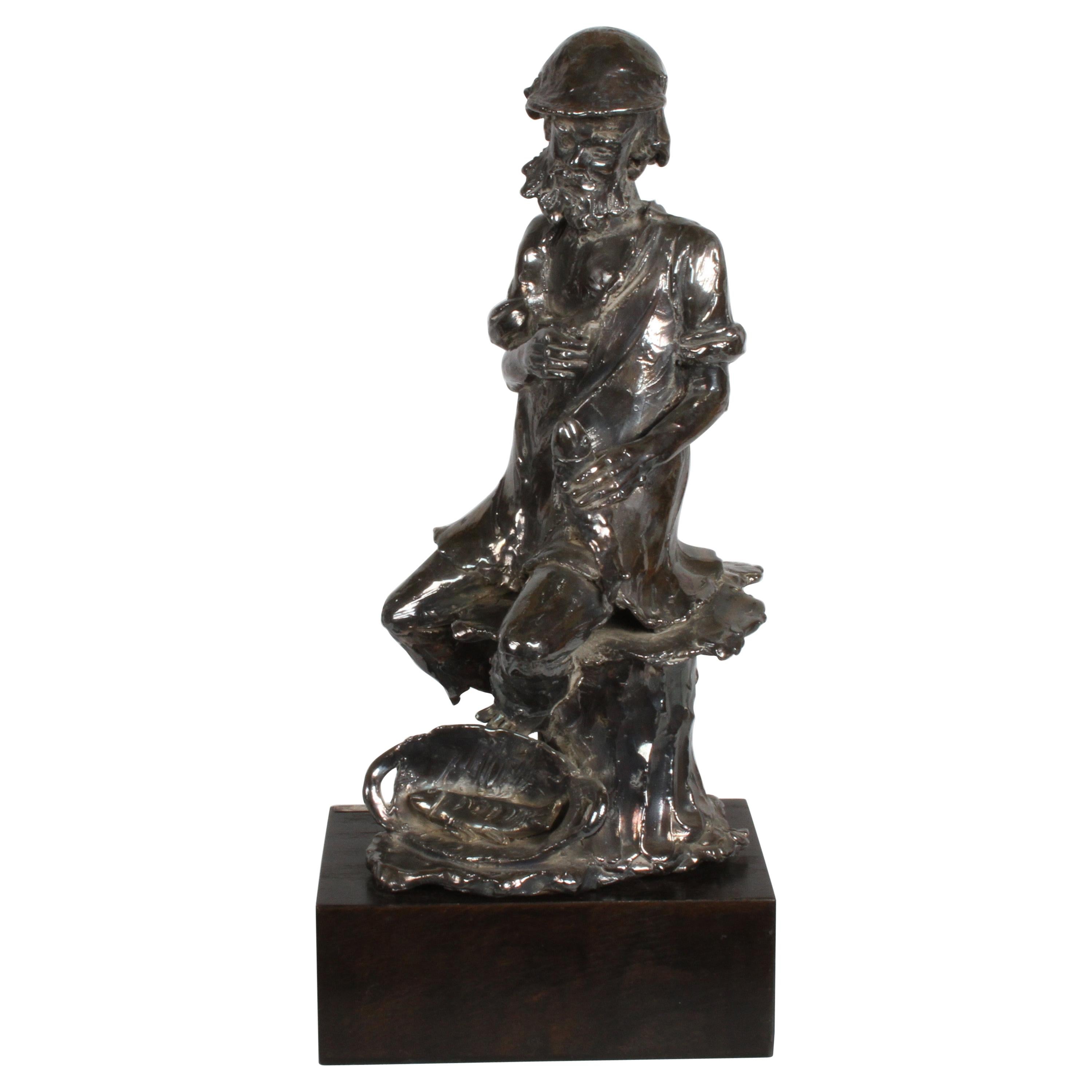 Canadian Sculptor Alice Winant, Sterling Sculpture of a Fisherman on Wood Base For Sale