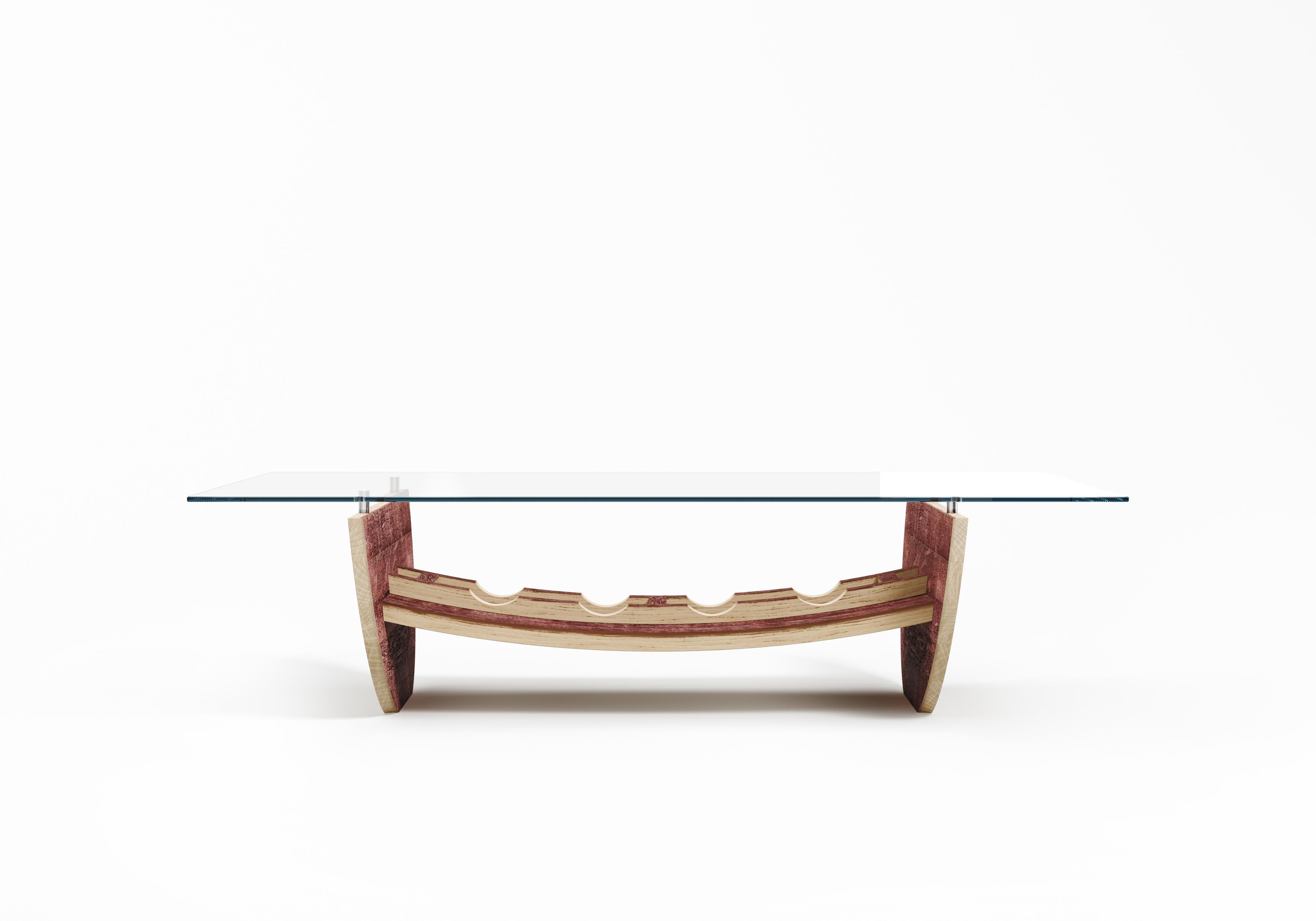 The Canai coffee table embodies a daring approach that places rarity at the forefront. Its semi-circular legs, repurposed from wine barrel lids, incorporate the concave structure of the staves, proudly showcasing the intrinsic beauty of wine aging