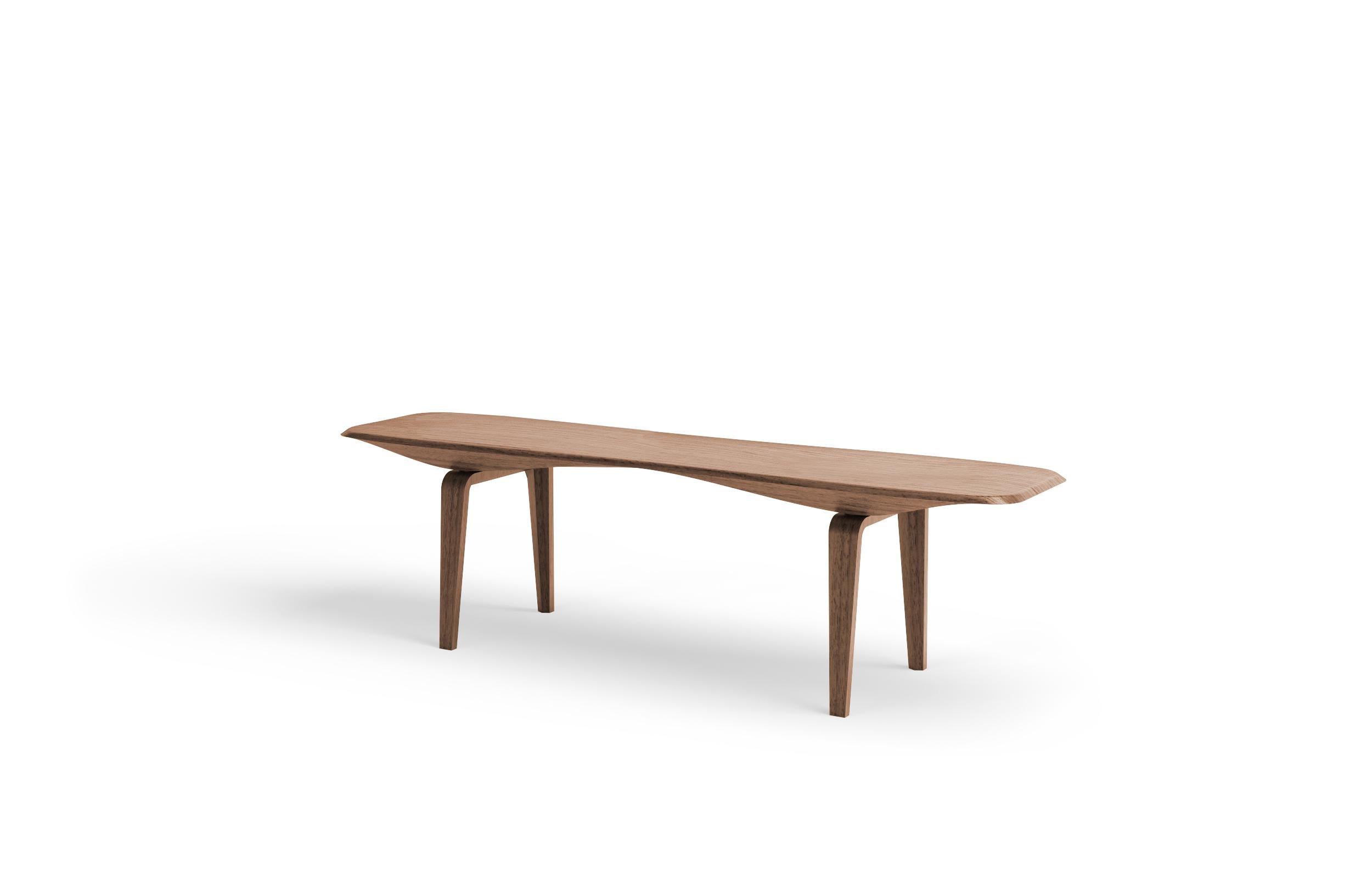 A sculptural wood bench at the intersection of functional art and furniture. KG bench merges mannerism with engineering. Carved out of the finest solid Noce Canaletto (Black Walnut), this bench merges visual lightness with solidity. In a continuous