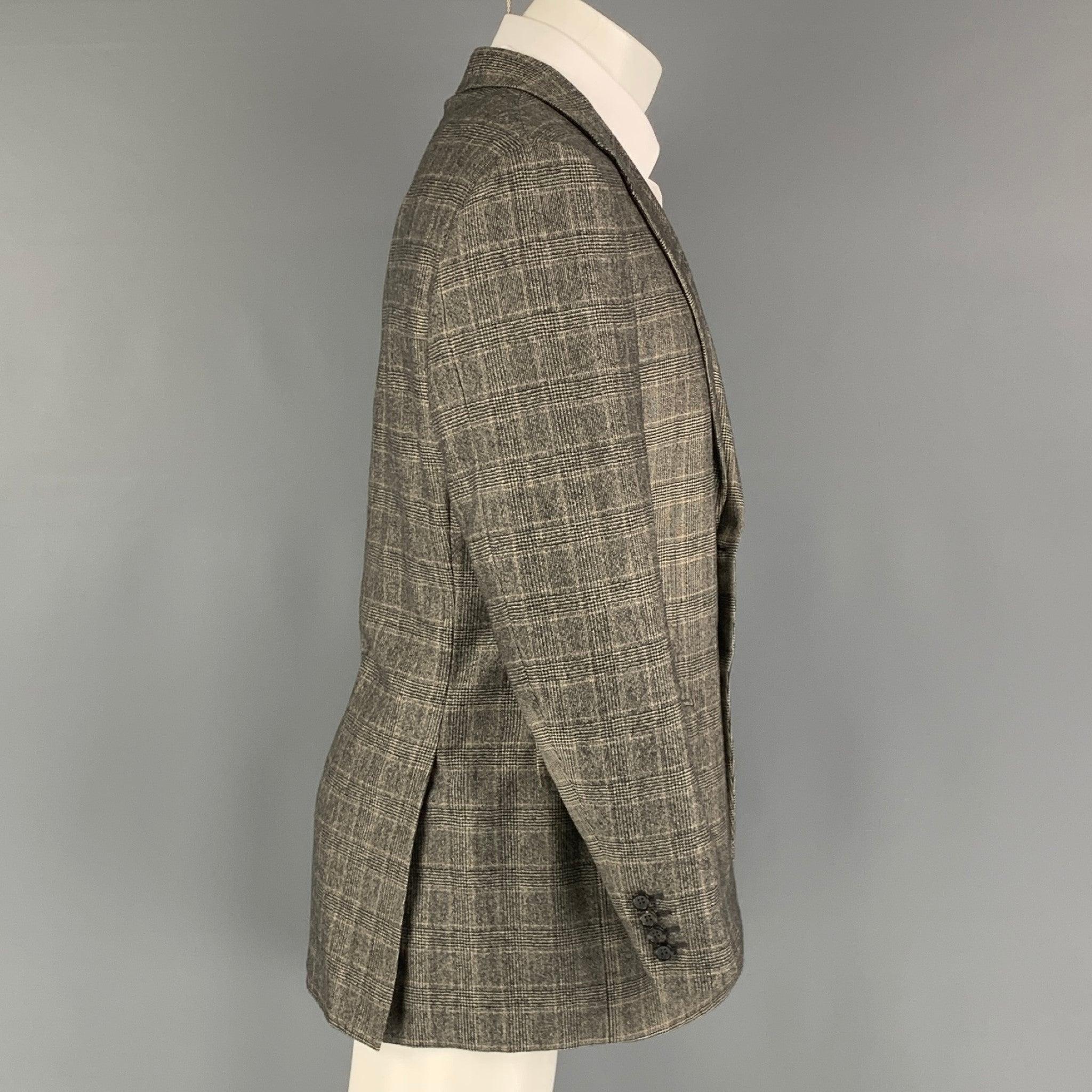 CANALI blazer comes in black and beige glenplaid cashmere material, featuring a notch lapel, flap pockets, 2 buttons closure, single breasted. Made in Italy. Excellent Pre-Owned Condition. 

Marked:   50R IT  

Measurements: 
  
Shoulder: 19 inches