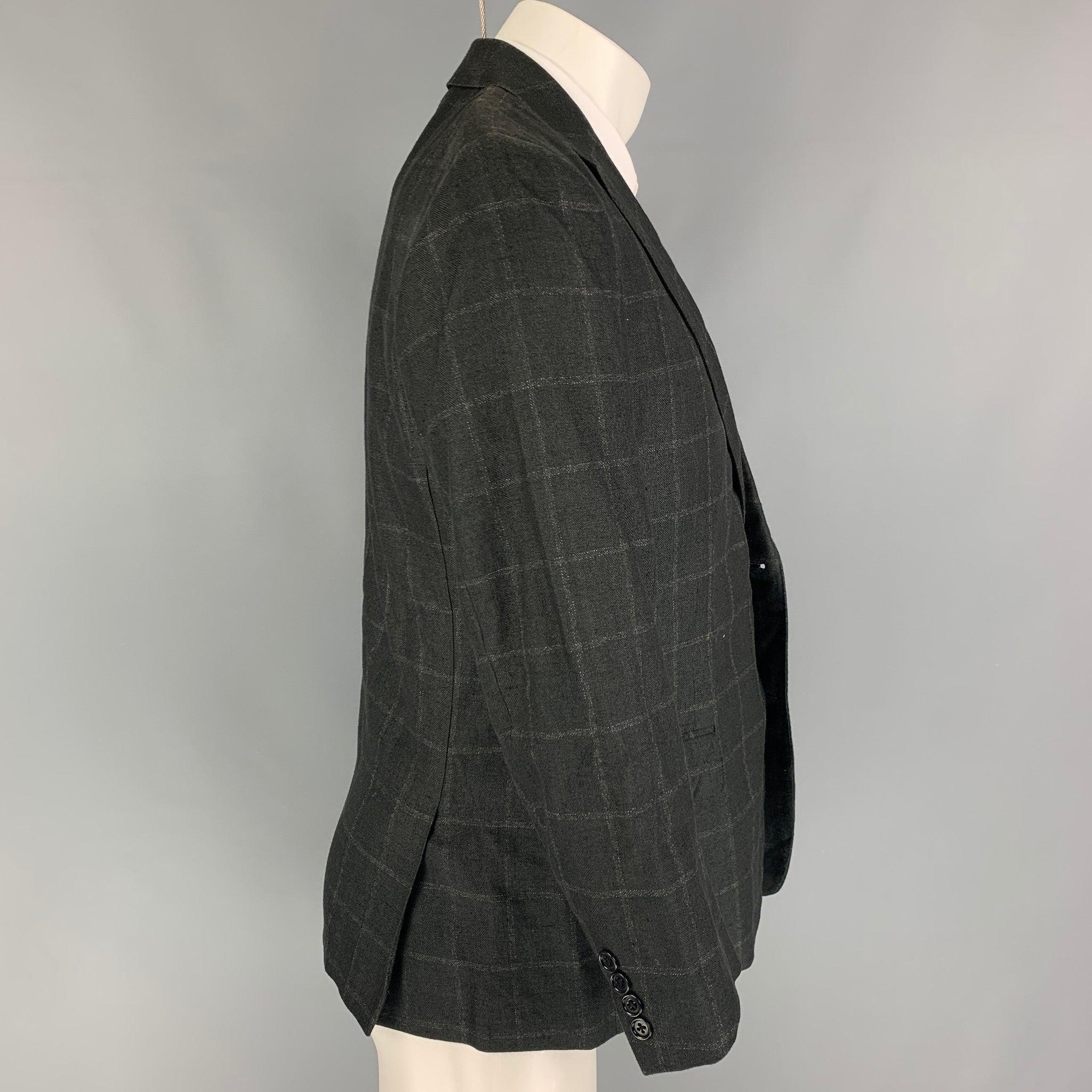 CANALI sport coat comes in a charcoal window pane silk with a full liner featuring a notch lapel, flap pockets, double back vent, and a double button closure. Made in Italy.
Very Good
Pre-Owned Condition. 

Marked:   48 

Measurements: 
 
Shoulder: