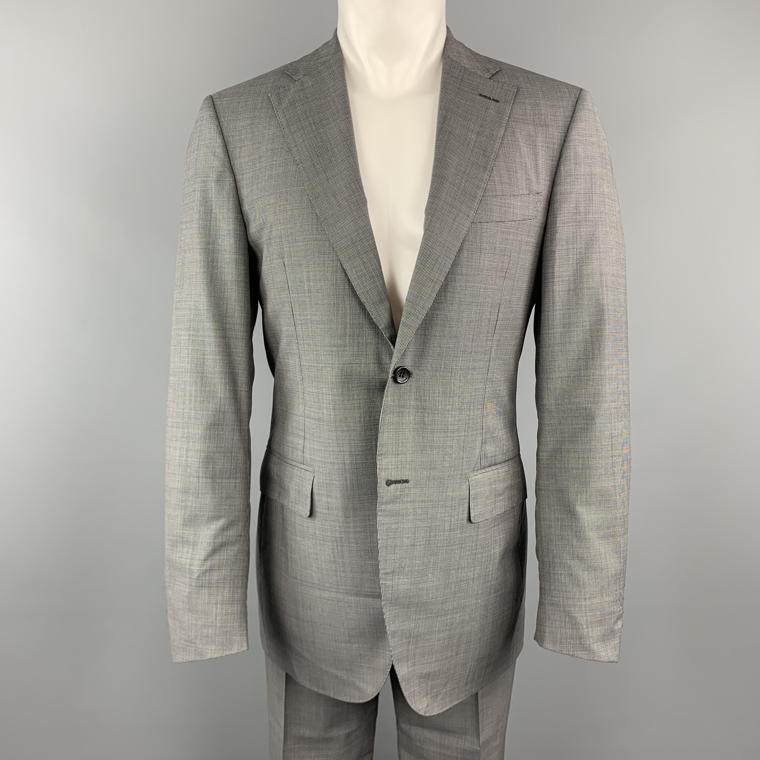 CANALI two piece suit comes in gray nailhead virgin wool and includes a notch lapel, single breasted sport coat and matching flat front trousers. Made in Italy.

Excellent Pre-Owned Condition.
Marked: IT 48

Measurements:

-Jacket
Shoulder: 17.5