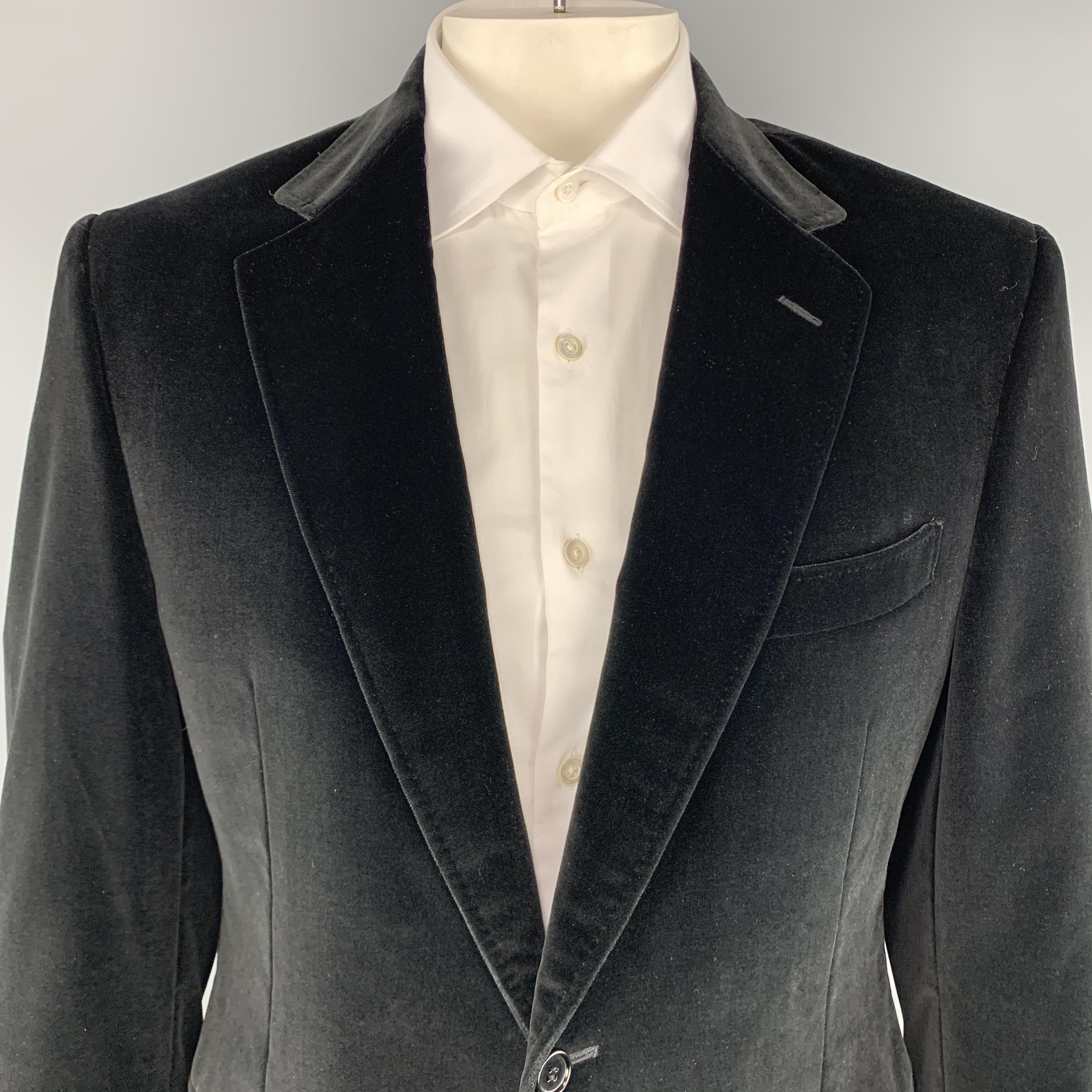 CANALI sport coat comes in black velvet with a notch lapel, single breasted, two button front, and single vented back. Made in Italy.

Excellent Pre-Owned Condition.
Marked: IT 52 R

Measurements:

Shoulder: 19 in.
Chest: 46 in.
Sleeve: 25 in.