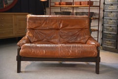 Canapé brutaliste en chêne et cuir patiné 1960's