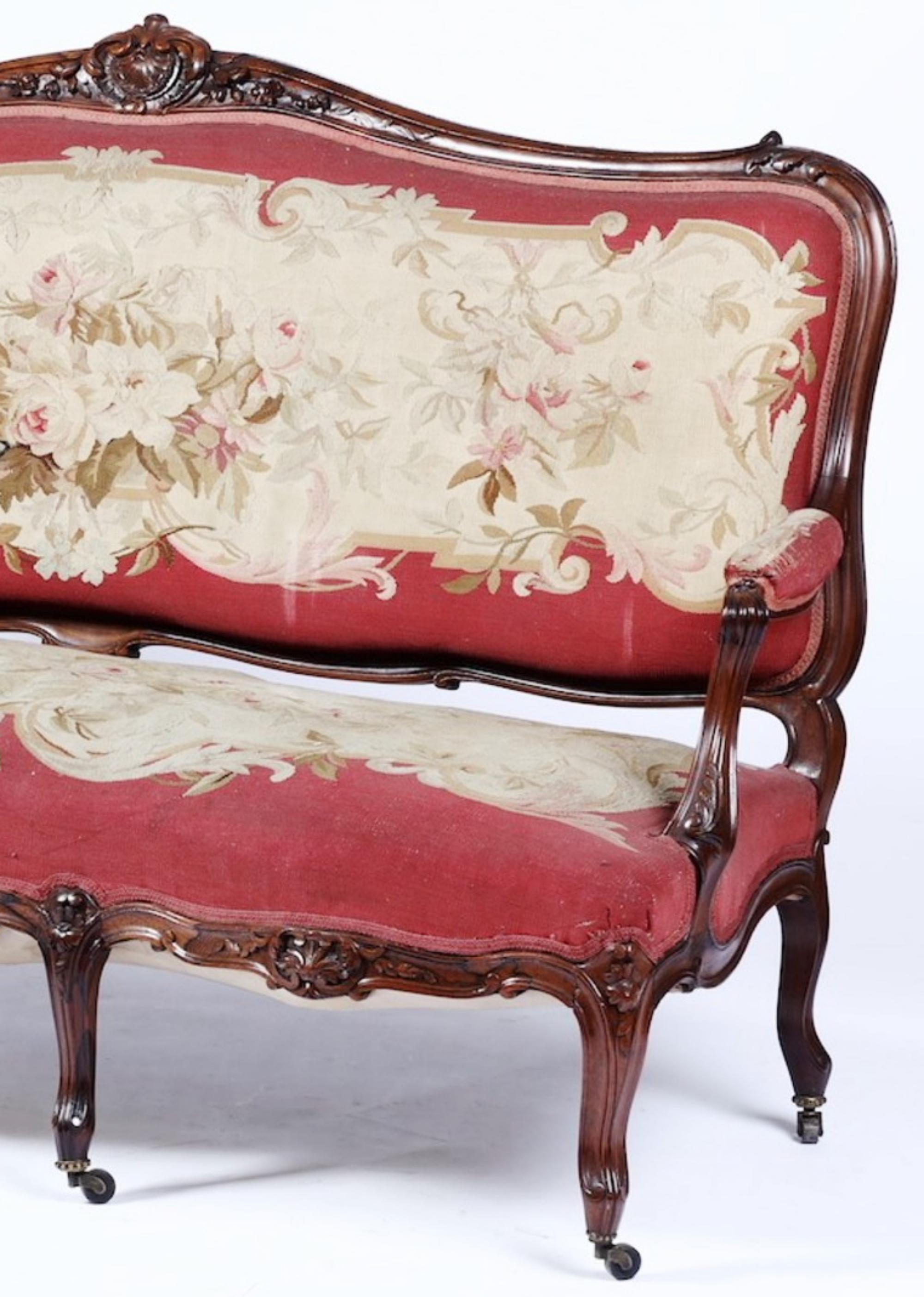 Canape Louis Philippe 19th century.
Width 188 - Prof. 75 - height 100 Cm
Rosewood carved with volutes and shell valves. Armrests and legs moved, feet fitted with wheels.
Seat and back upholstered and covered with Aubusson embroidered
