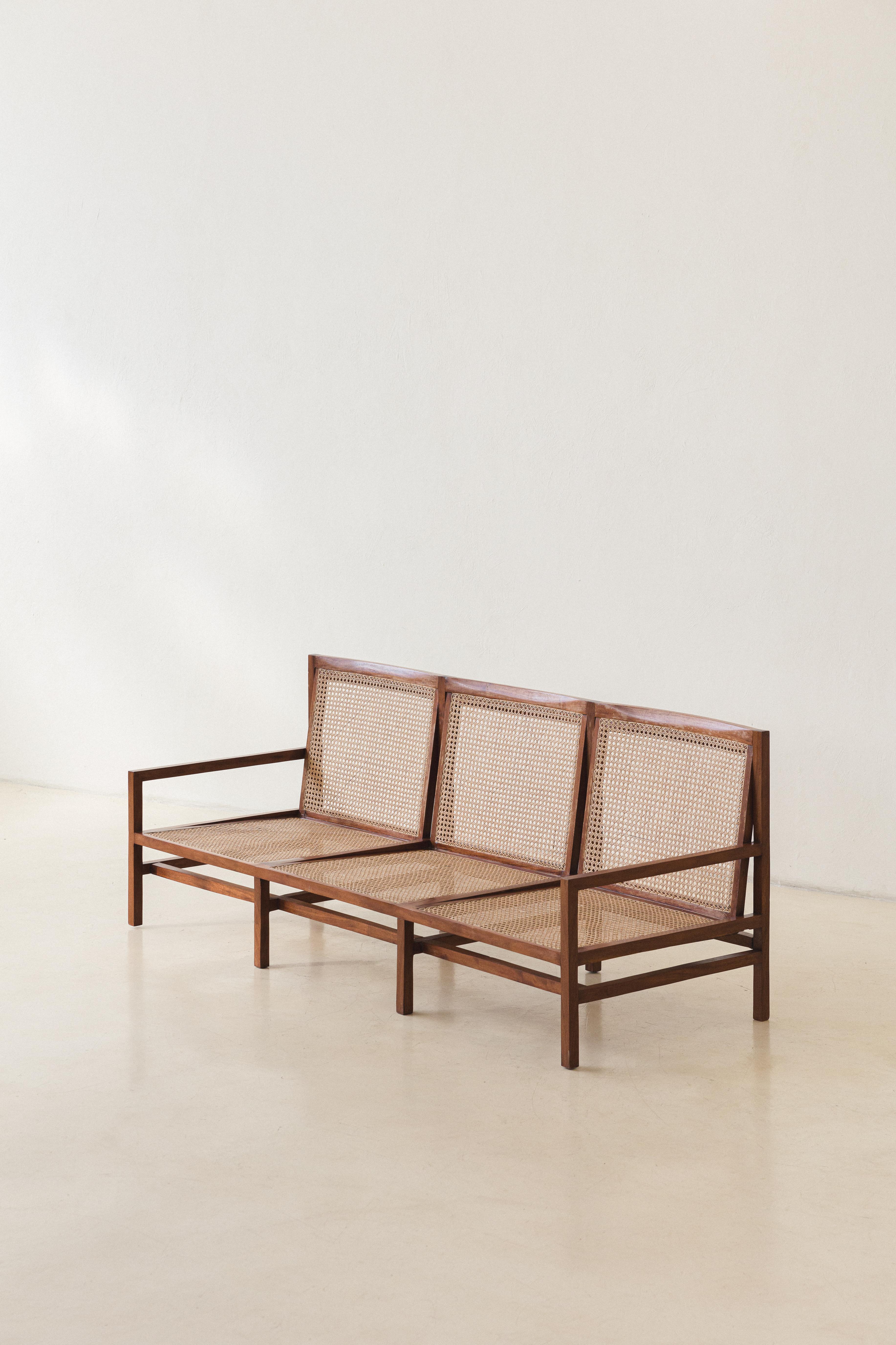 Joaquim Tenreiro (1906-1992) is known as the “father” of Brazilian modernism, being one of the pioneers, with a work that reflects a refined coexistence of traditional values and modern aesthetics. This living room set, composed of Cane Sofa and