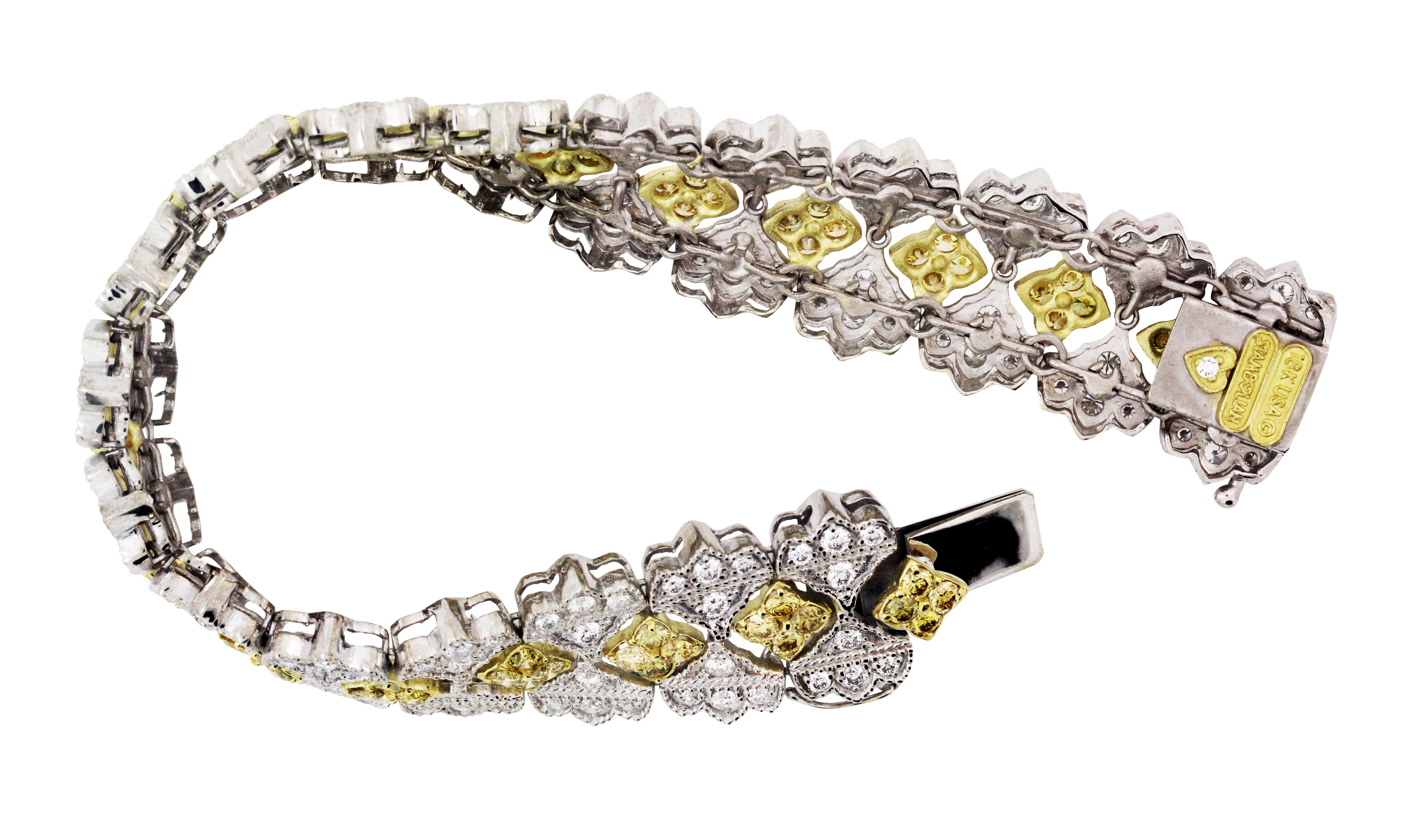18K Yellow and White Two-Tone Gold White and Yellow Diamond Flexible Bracelet

5.03 carat Canary Diamonds
5.00 carat White Diamonds (G color, VS clarity)

This flexible bracelet is from the Stambolian 