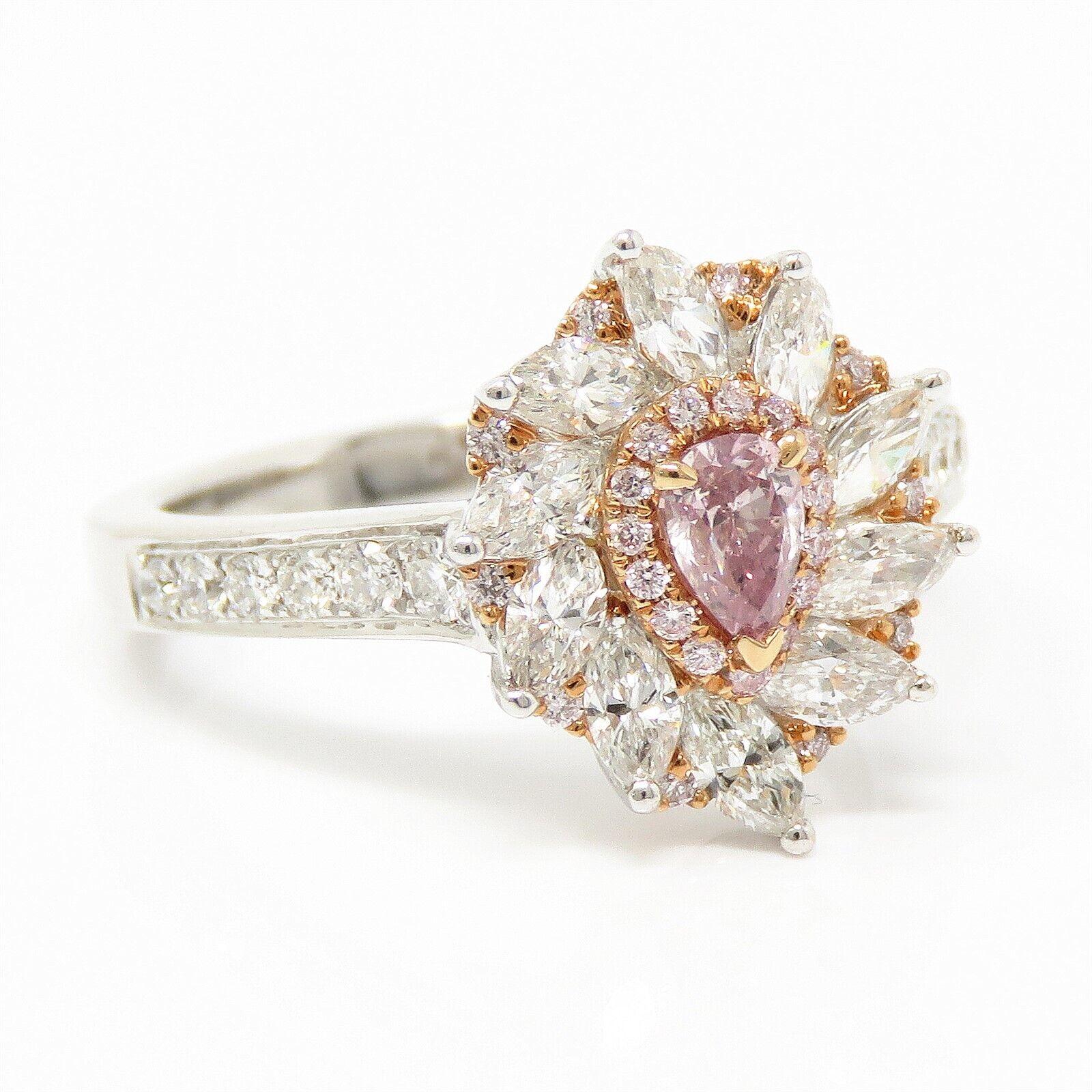 Canary Star 18K Ring with Fancy Pink and Purple-Pink Diamonds
An elegant and colorful creation marked Canary Star 18K, this ring features a vibrant array of natural diamonds, including 15 fancy pink diamonds (approx. VS clarity) and a captivating