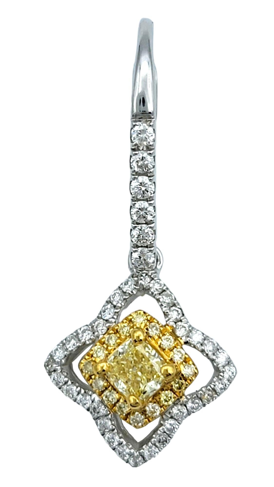 This stunning pair of Canary Star yellow and white diamond dangle earrings are exquisitely set in 18 karat yellow and white gold. These captivating earrings feature a dazzling array of diamonds, artfully arranged to create a radiant display of