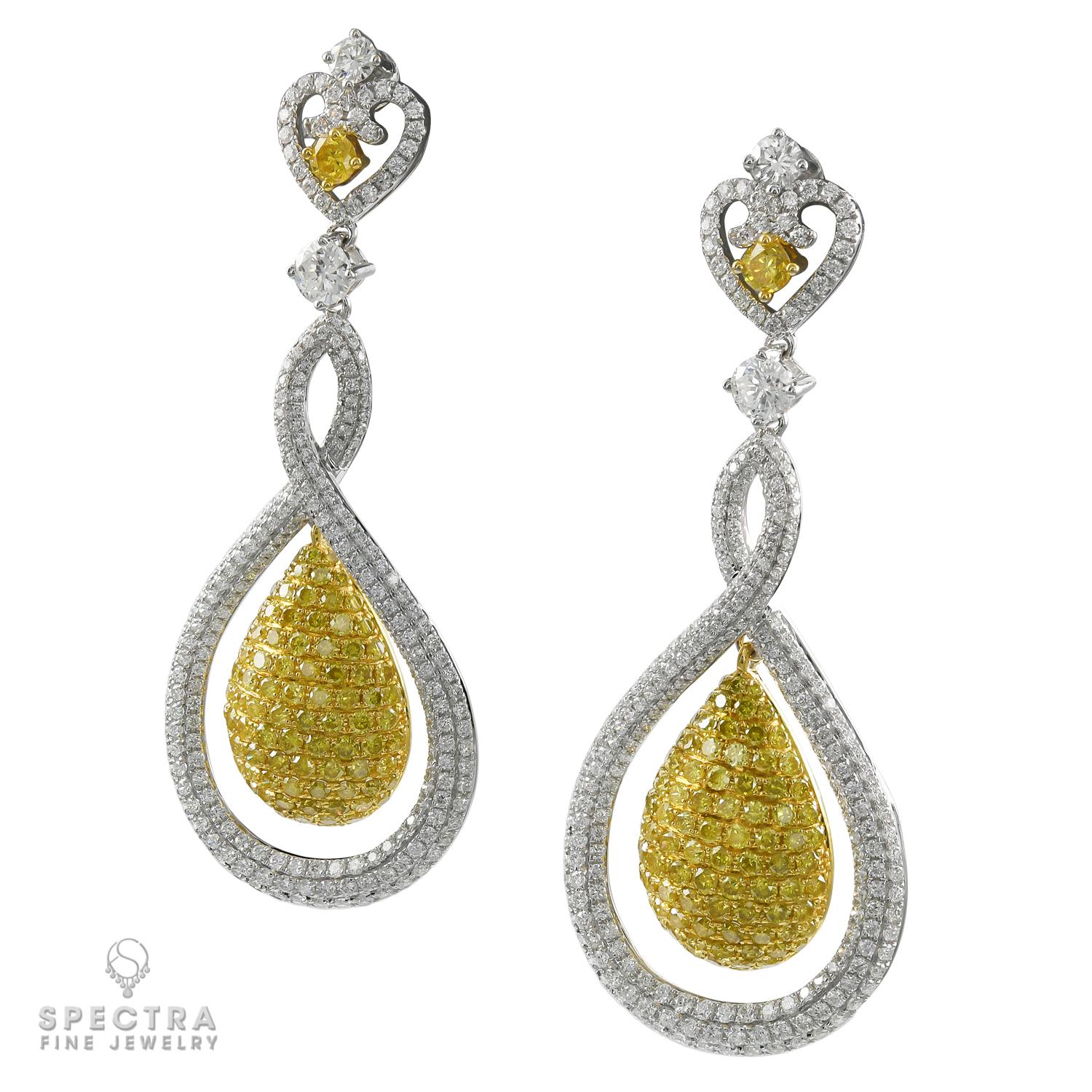 A beautiful pair of drop earrings set with round brilliant-cut diamonds, crafted in 18k white & yellow gold.
Total weight of diamonds is approximately 11 carats, most are fancy yellow diamonds. White diamonds are of G-H color and VS-SI