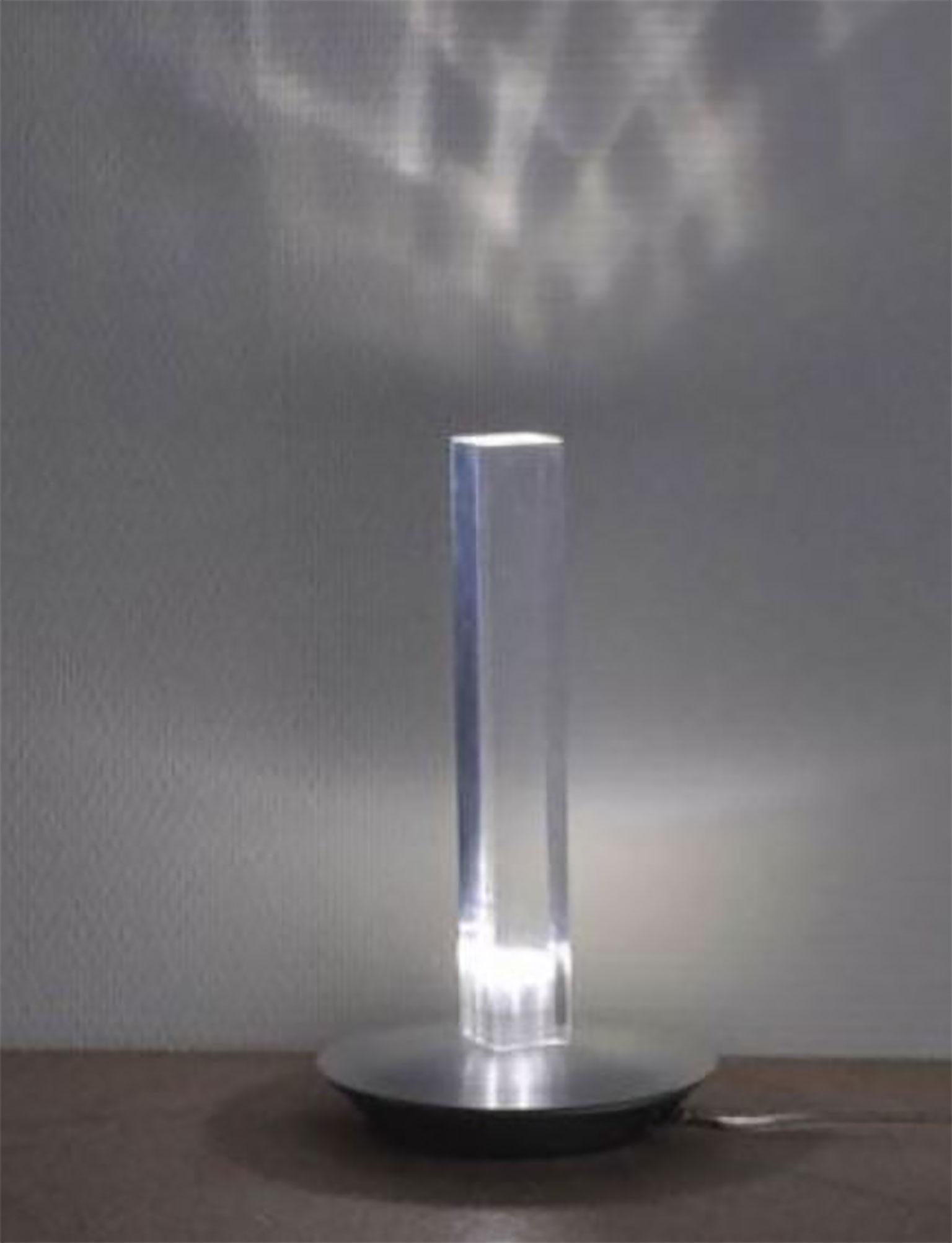 Cand-LED lamp is designed by Marta Laudani & MarCo Romanelli for Oluce. This is the candle re-invented for the modern age. Retaining the essence of a traditional candle yet transformed into a fixture fitting our new millennium. The base is made of